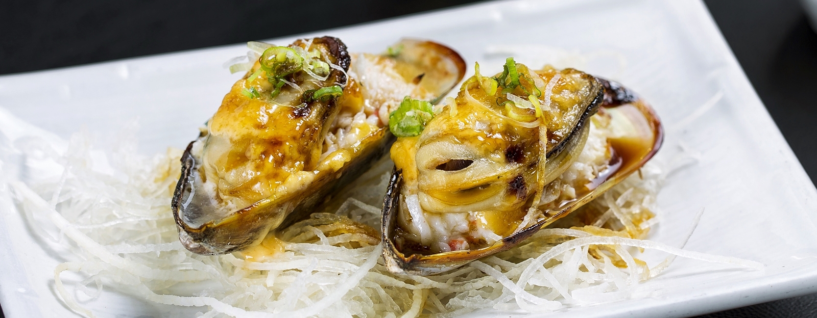 Order Baked Mussels food online from PB Sushi store, San Diego on bringmethat.com
