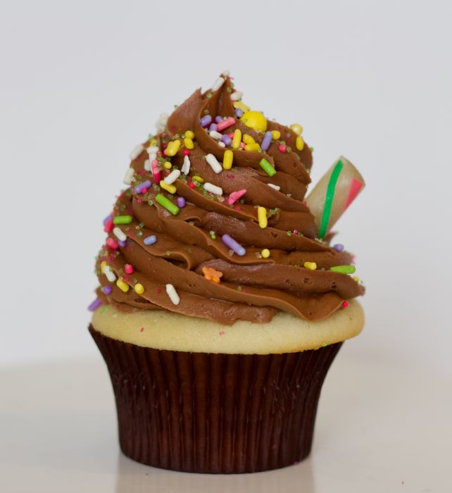 Order Vanilla Cake with Chocolate Buttercream Cupcake food online from Sas Cupcakes store, Charlotte on bringmethat.com