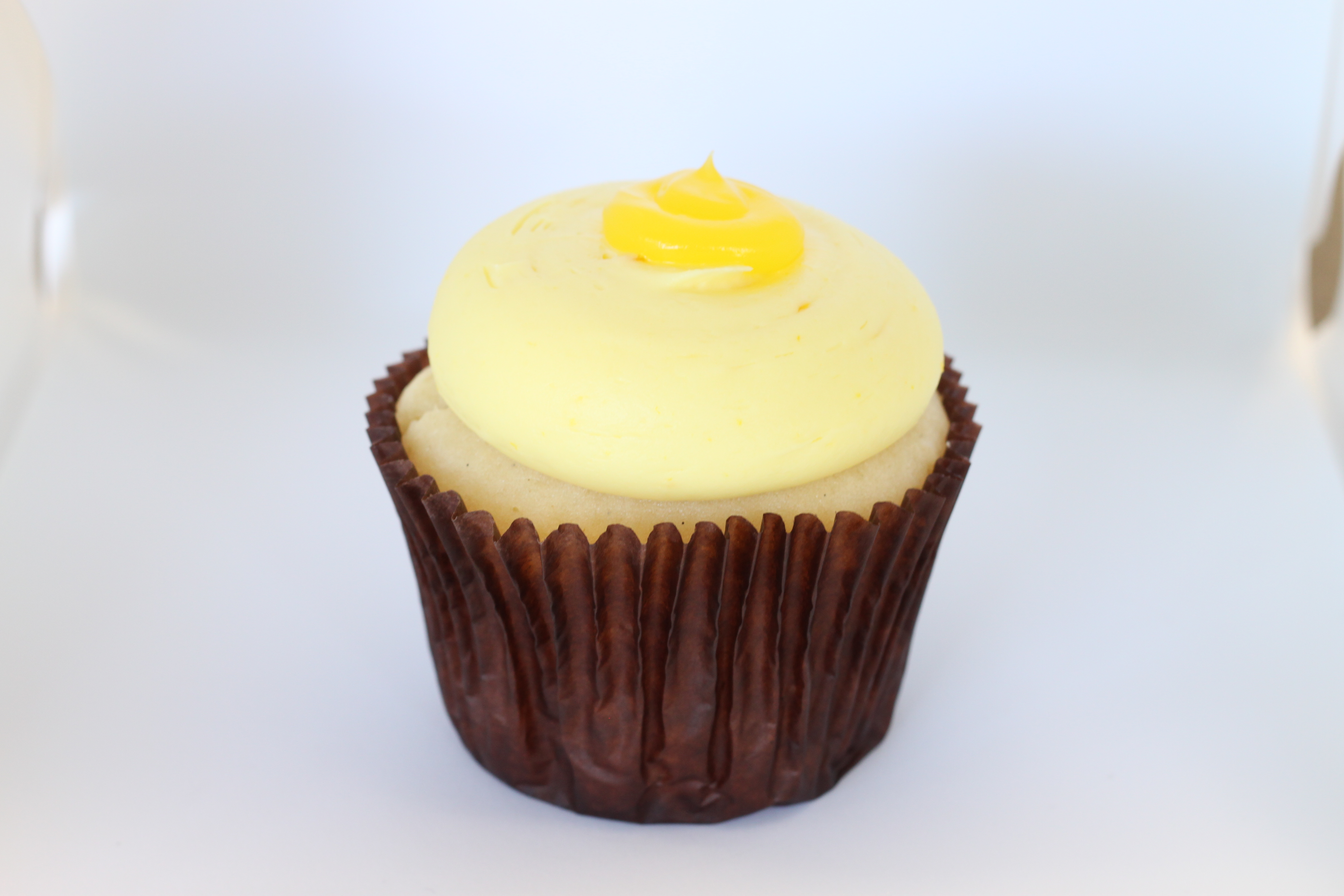 Order Lemon Drop Cupcake food online from Smallcakes Cupcakery And Creamery store, Garhanna on bringmethat.com