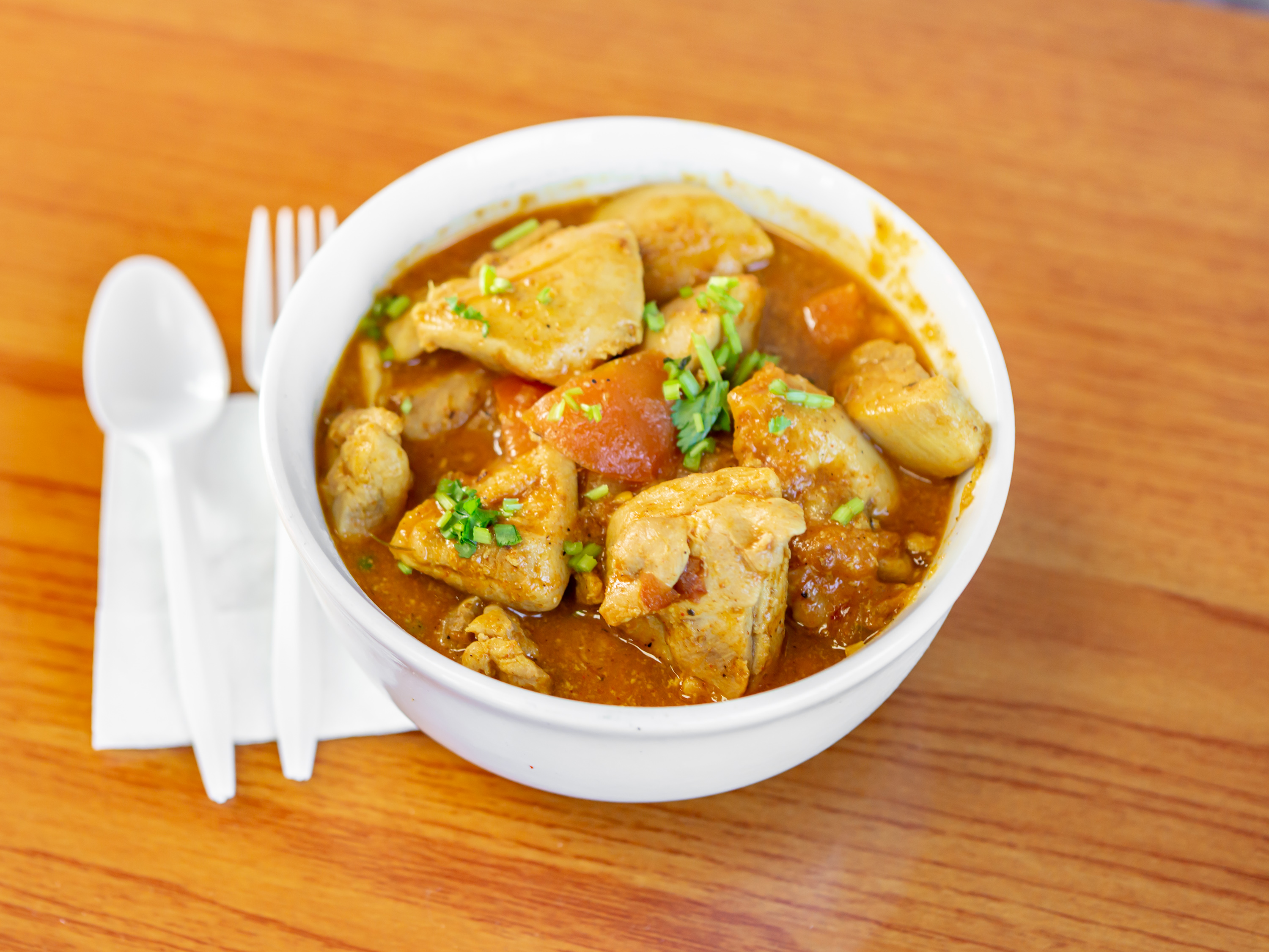 Order C002. Chicken Curry ( village style : bone in ) food online from Wok Mandu store, Ypsilanti on bringmethat.com