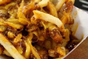 Order Chili Fries with Cheese (910 cal) food online from Leo Coney Island store, Shelby Charter Township on bringmethat.com