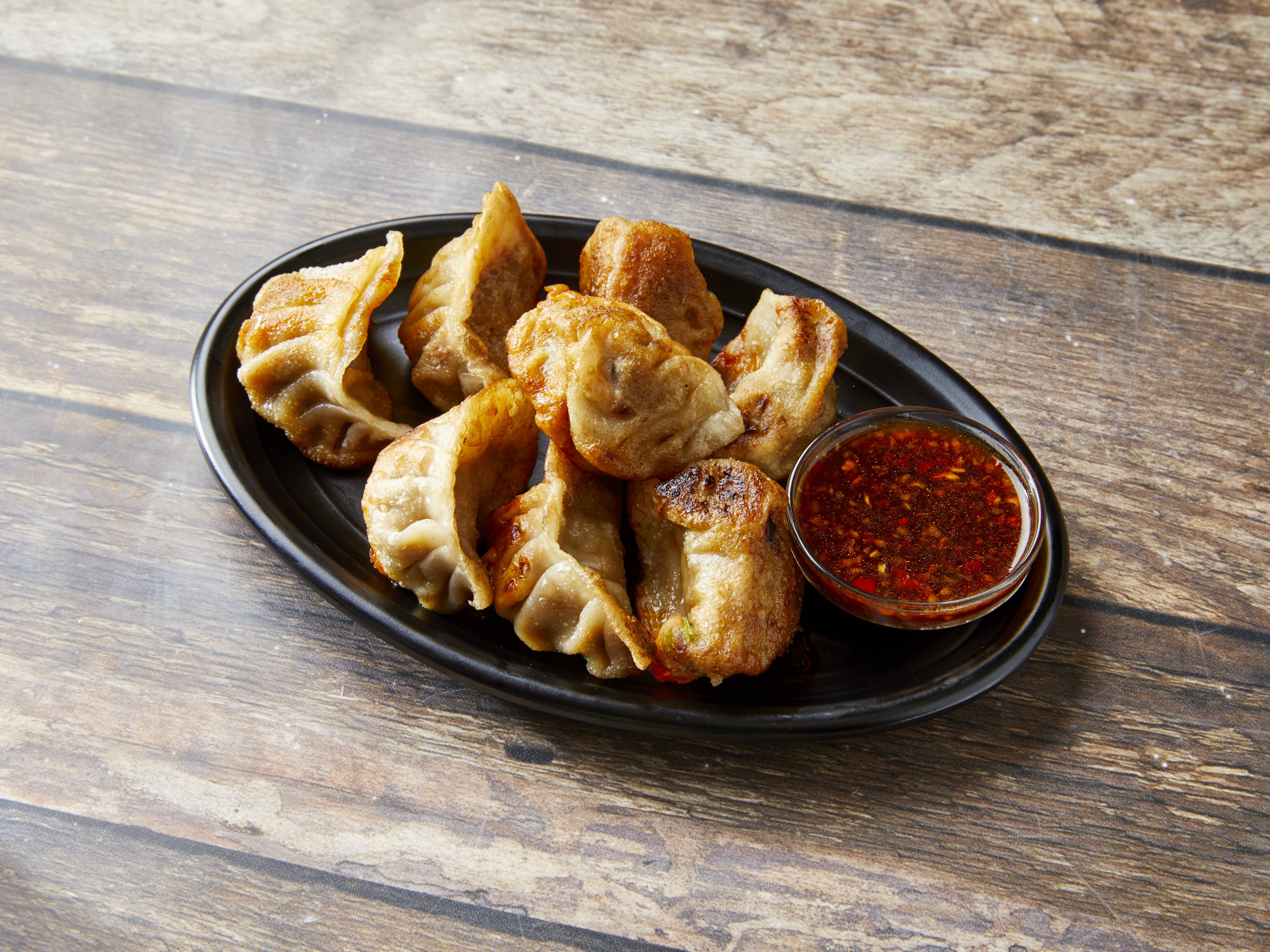 Order 18. Fried Dumplings food online from New China One store, Detroit on bringmethat.com
