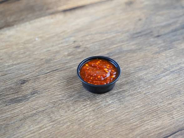 Order Spicy Sauce 1oz food online from Dimassi's Mediterranean Kitchen store, Humble on bringmethat.com