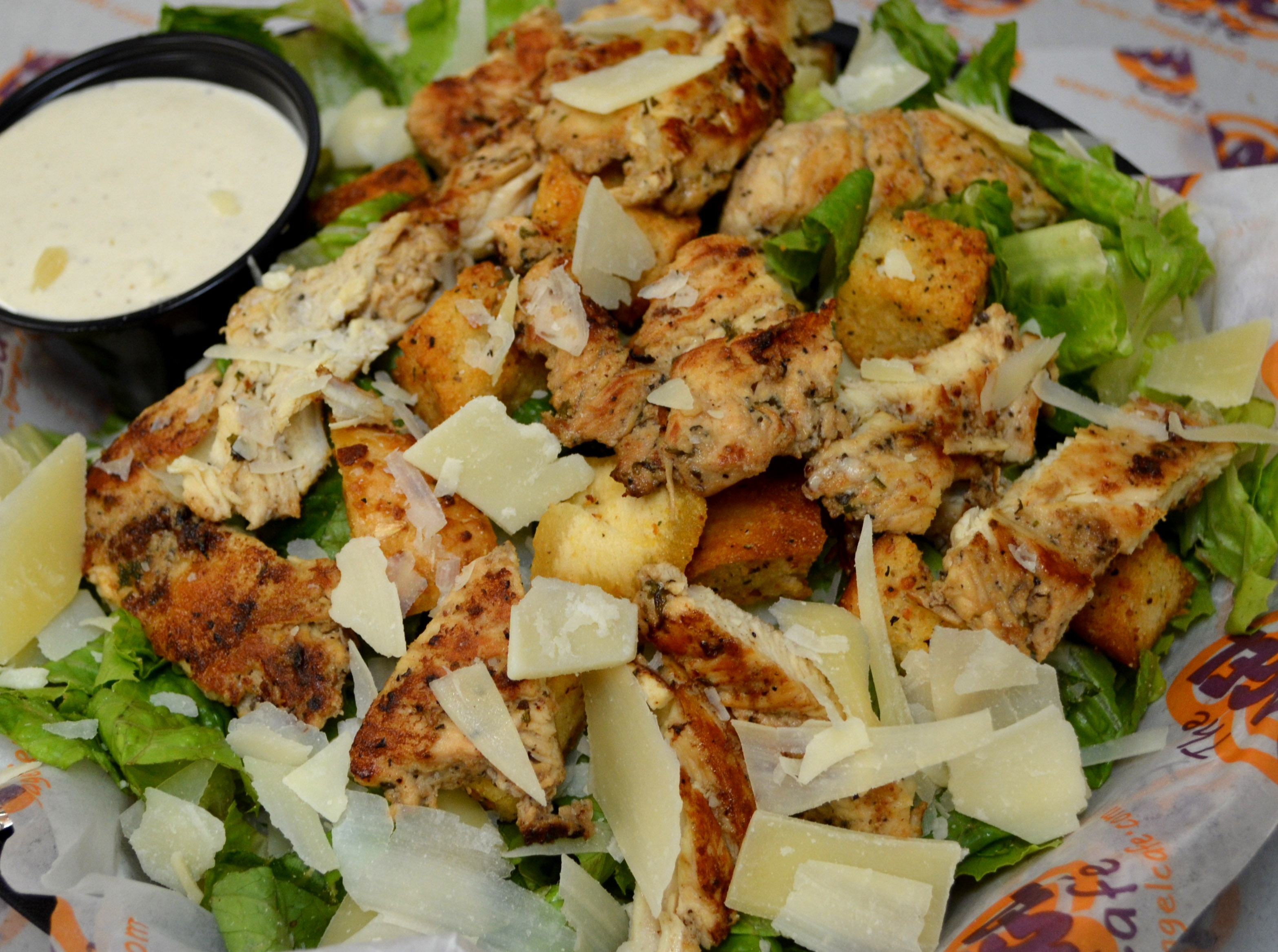 Order Grilled Chicken Caesar Salad food online from Bagel Cafe store, Herndon on bringmethat.com
