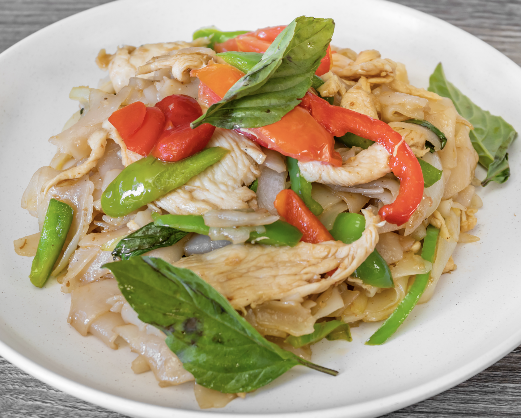 Order Thai Drunken Noodle  food online from Sriracha Thai Restaurant store, Carson on bringmethat.com