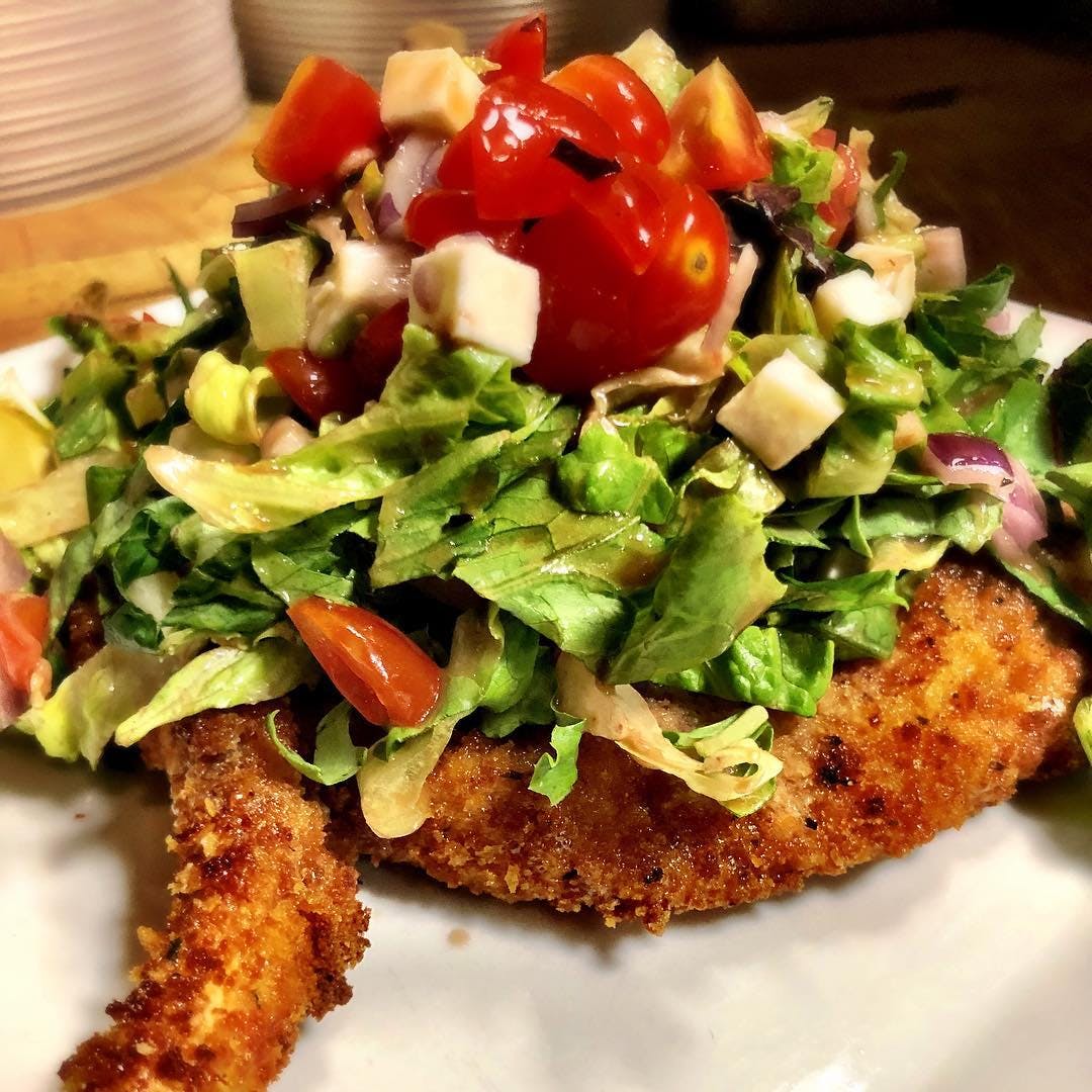 Order Pork Chop Milanese - Entree food online from Tomato Tomato store, Stamford on bringmethat.com