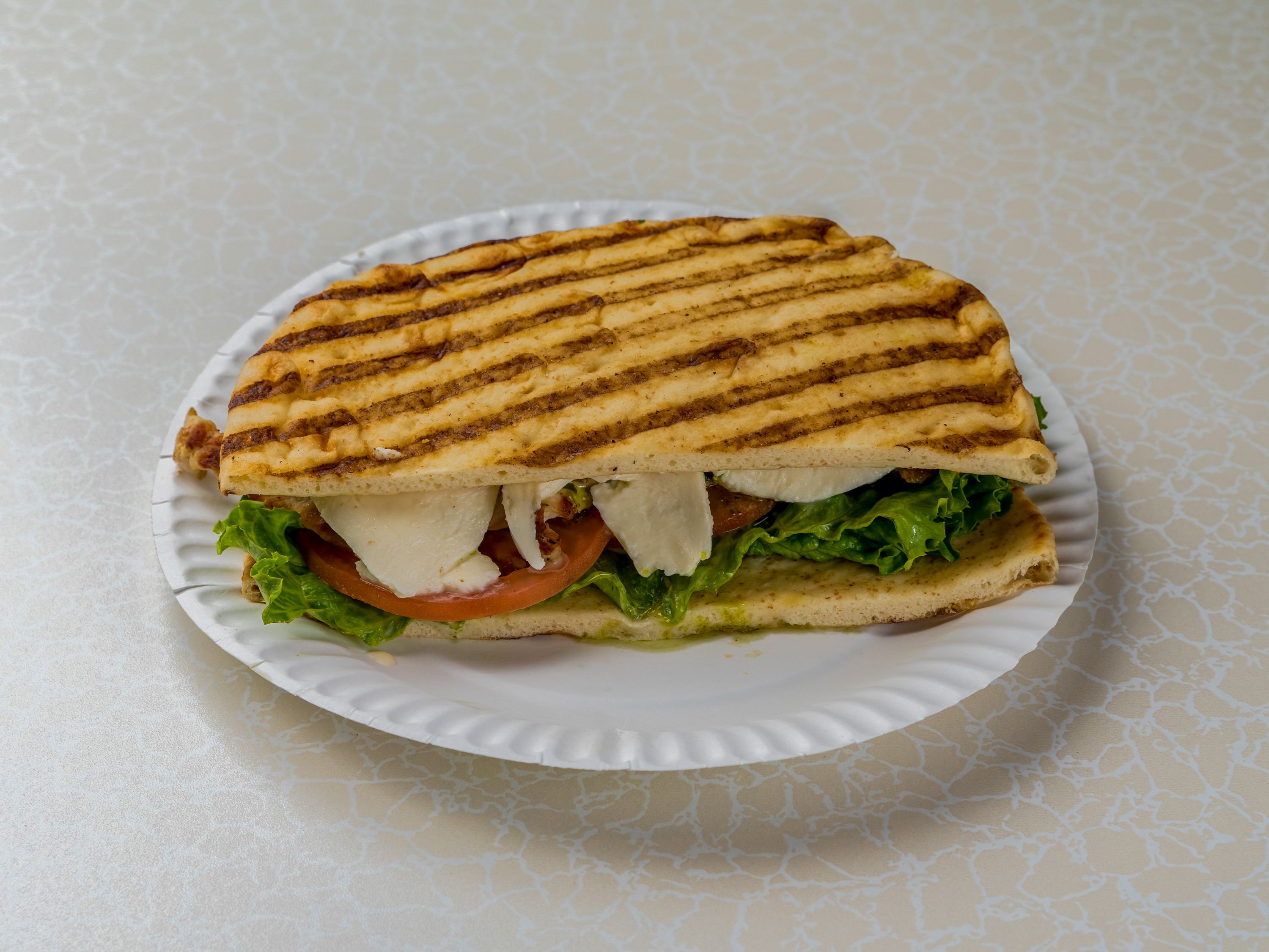 Order Panini with Tuscan Style Grilled Chicken food online from Gemini Deli store, Melville on bringmethat.com