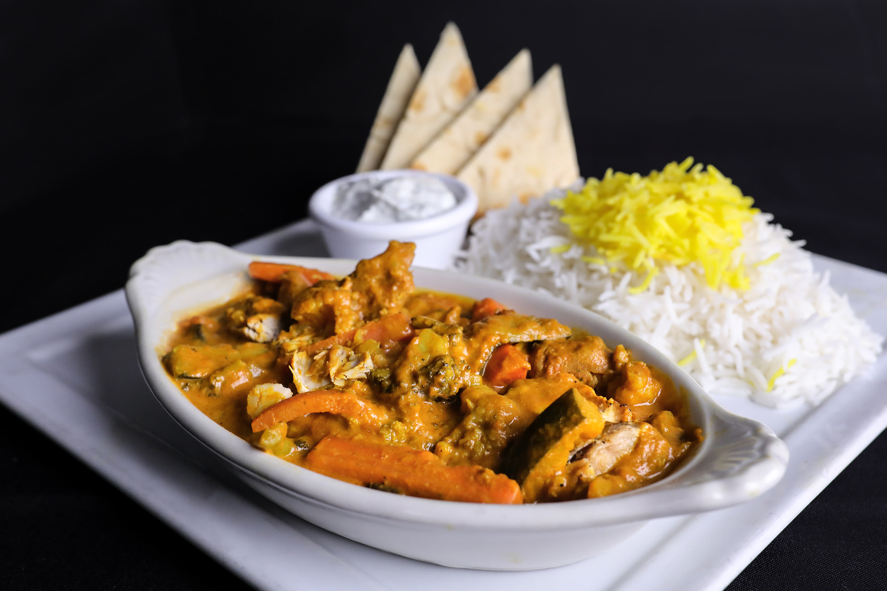 Order Yellow Chicken Curry Plate food online from Port Restaurant & Bar store, Corona Del Mar on bringmethat.com