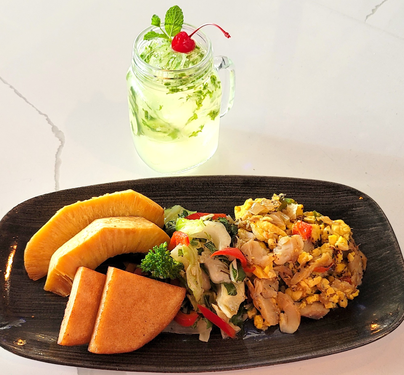 Order Ackee & Saltfish with Bammy and Seasonal Vegetables food online from The Simpson Restaurant & Bar store, Brooklyn on bringmethat.com