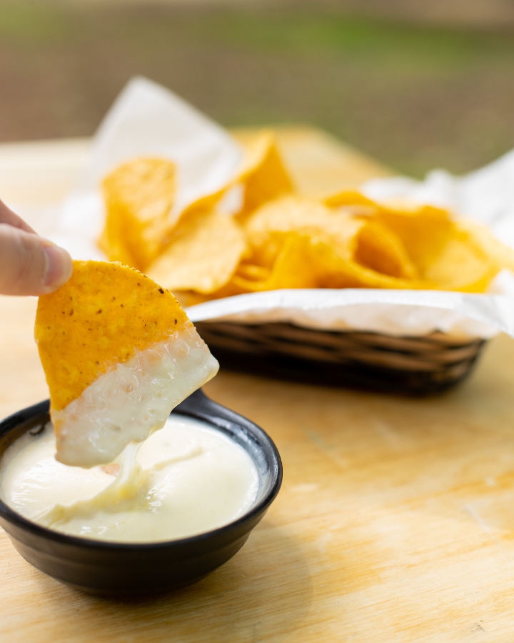 Order Queso Dip food online from Totopos store, Cary on bringmethat.com