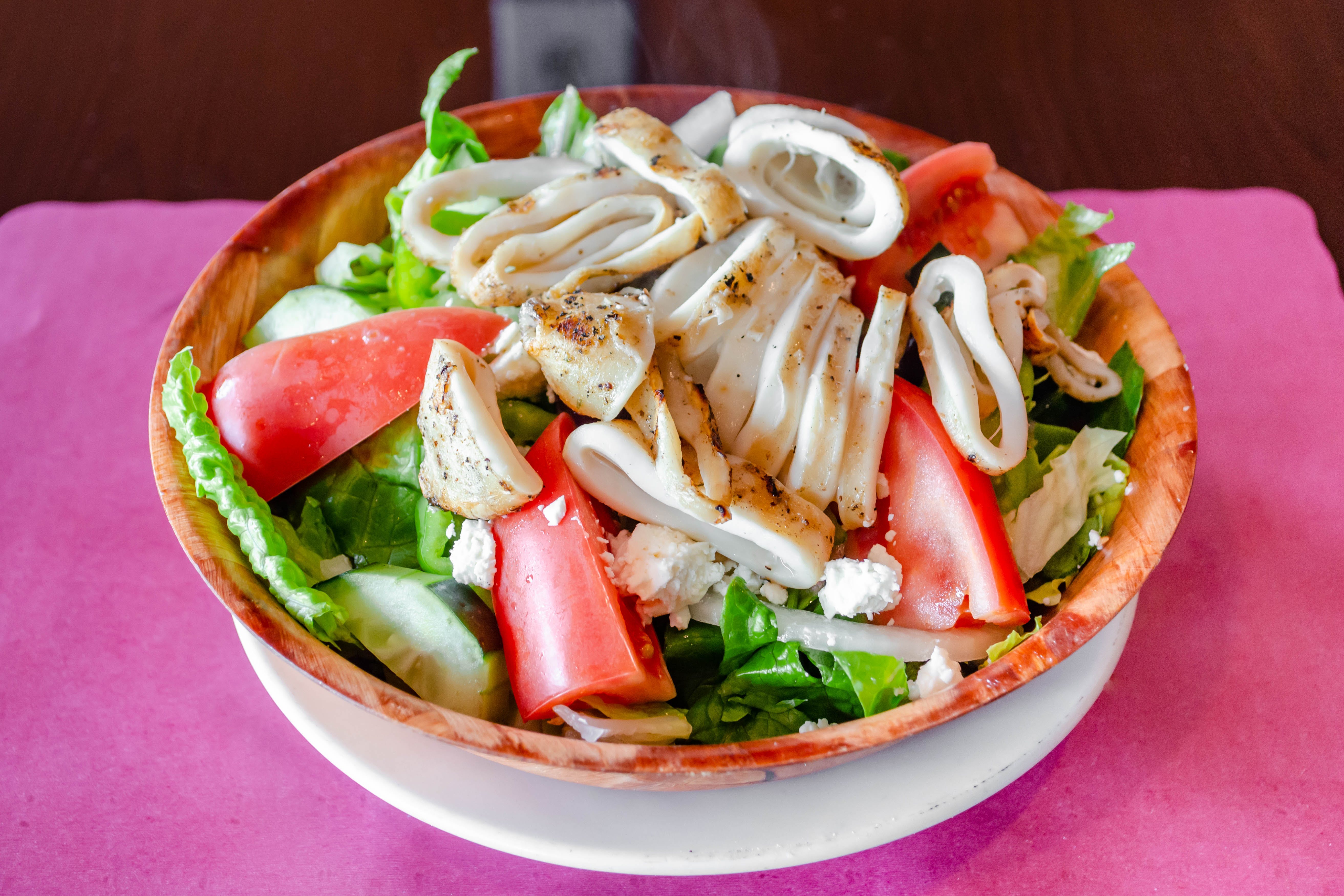Order Greek Salad with Grilled Calamari - Small food online from Mykonos Restaurant store, North Arlington on bringmethat.com