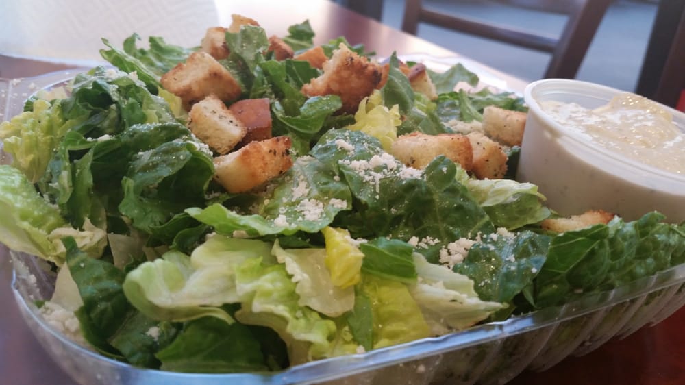 Order Caesar Salad food online from Fat Tomato Pizza store, Hermosa Beach on bringmethat.com