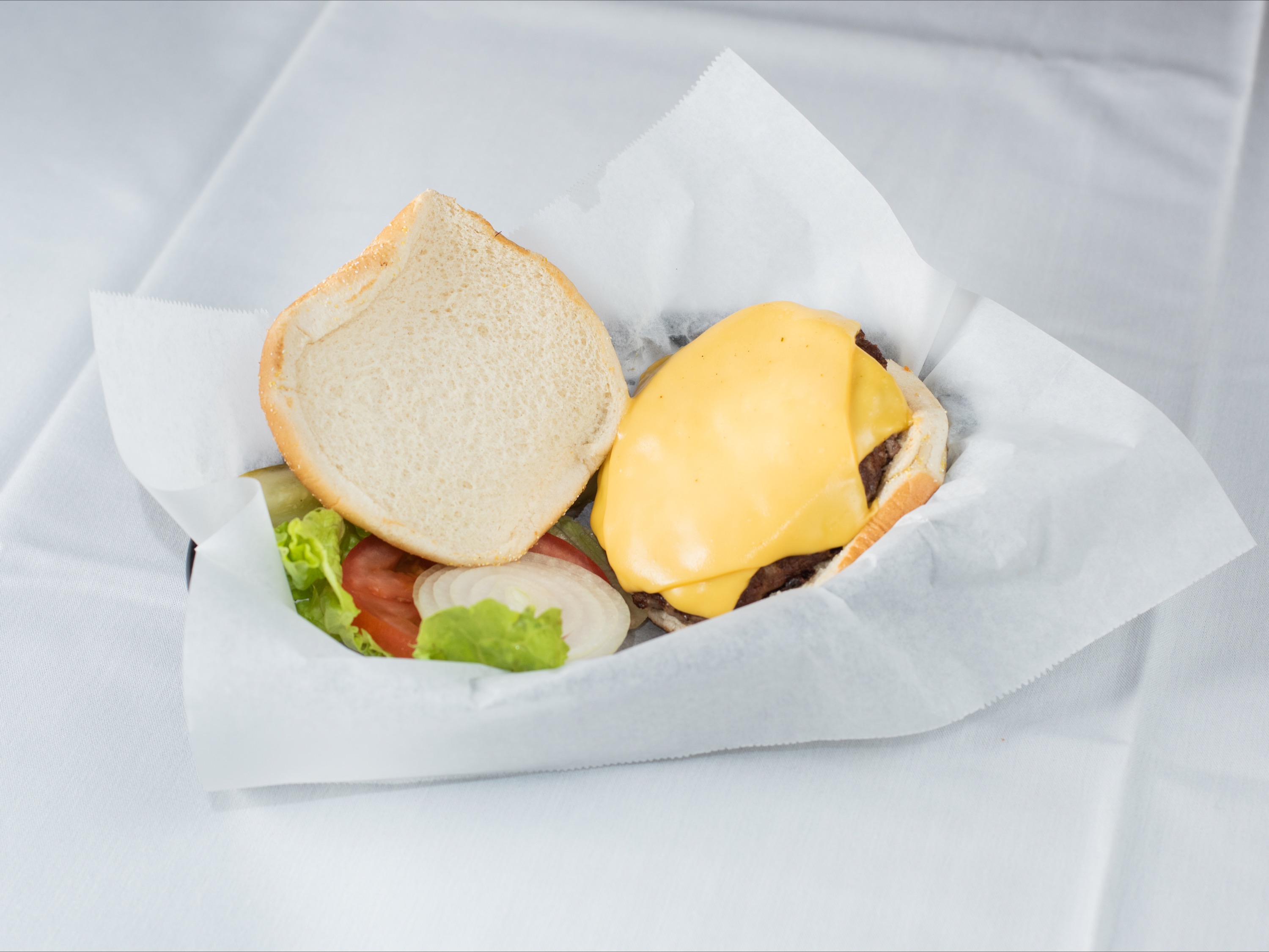 Order 1/4 lb. Cheeseburger food online from Hide Away Cafe & Lounge store, Bensenville on bringmethat.com
