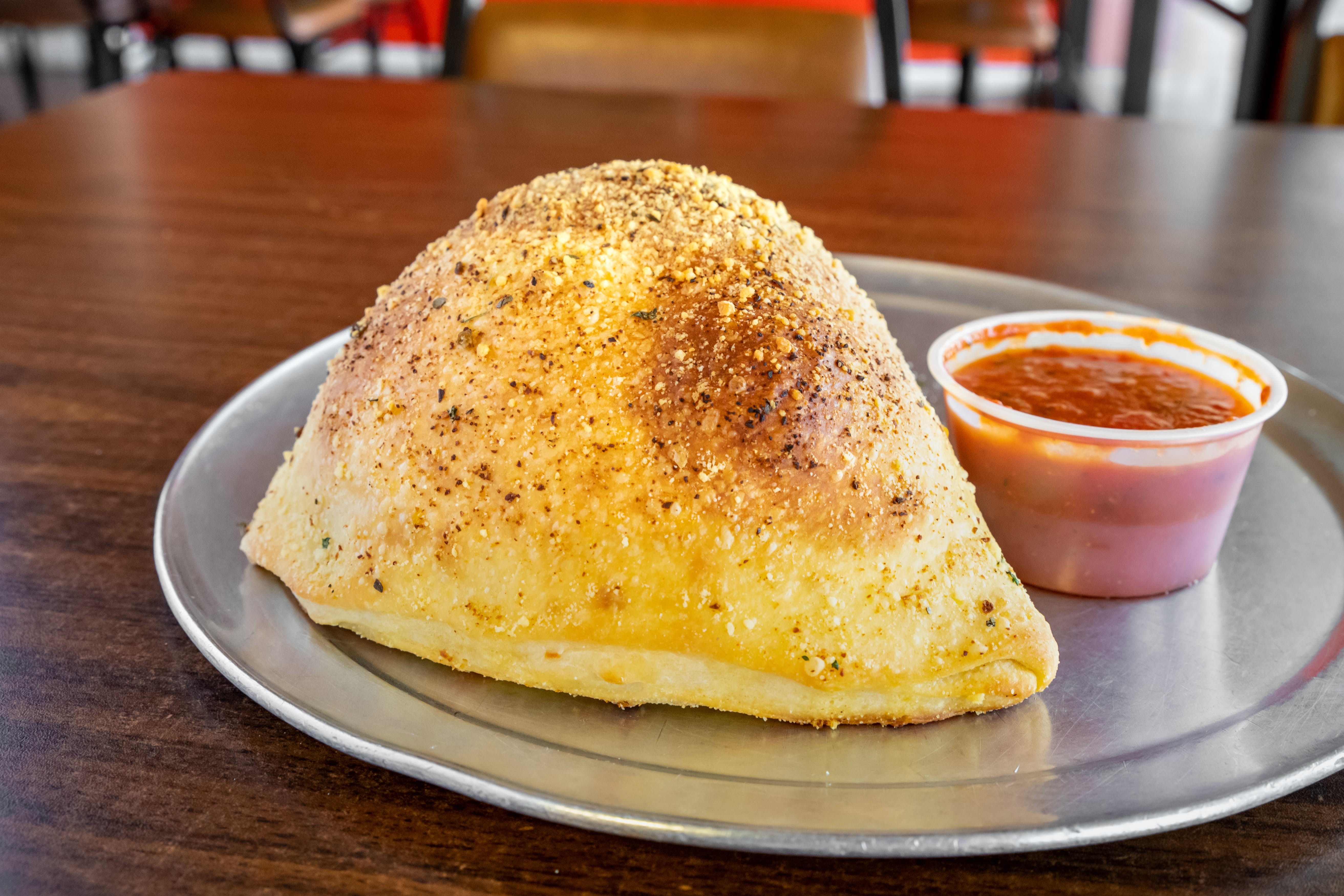 Order One Topping Calzone - Calzone food online from Alex's Pizza Pasta Subs Granbury store, Granbury on bringmethat.com