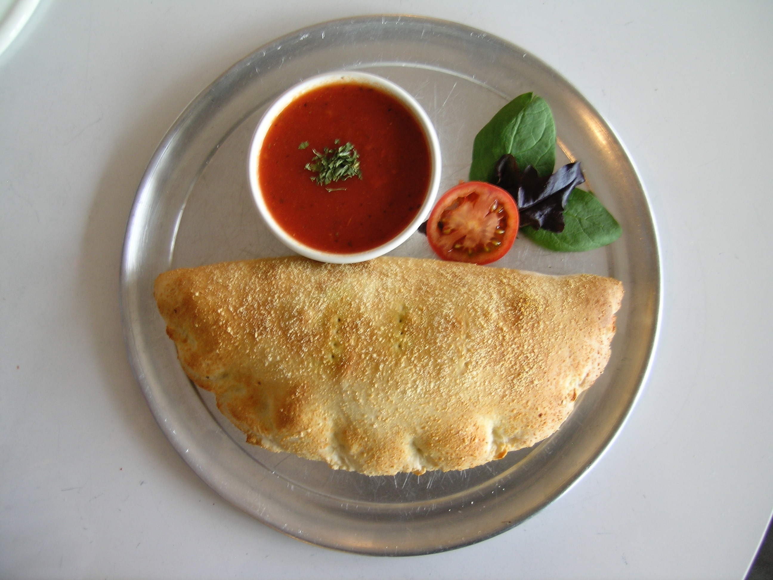 Order Tivoli Calzone food online from Romes Pizza store, Helotes on bringmethat.com