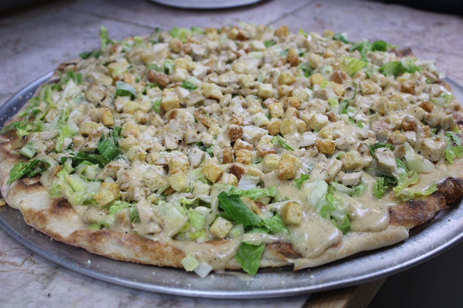 Order Chicken Caesar Pizza - Small food online from Rhythm And Spice Pizzeria And Grill store, New Brunswick on bringmethat.com