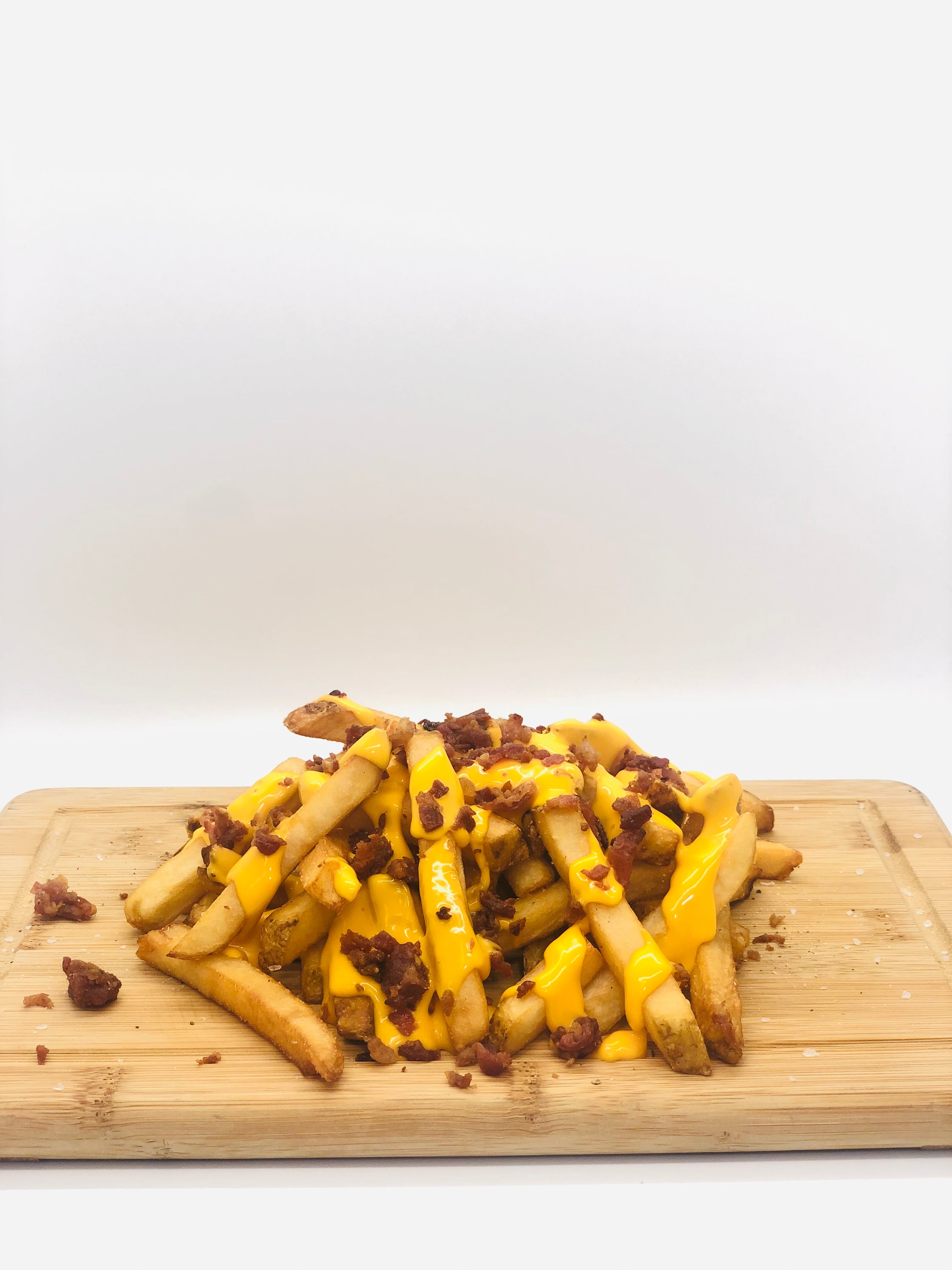 Order Cheese Fries with Bacon - Small food online from Piezanos Pizza store, Ocean City on bringmethat.com