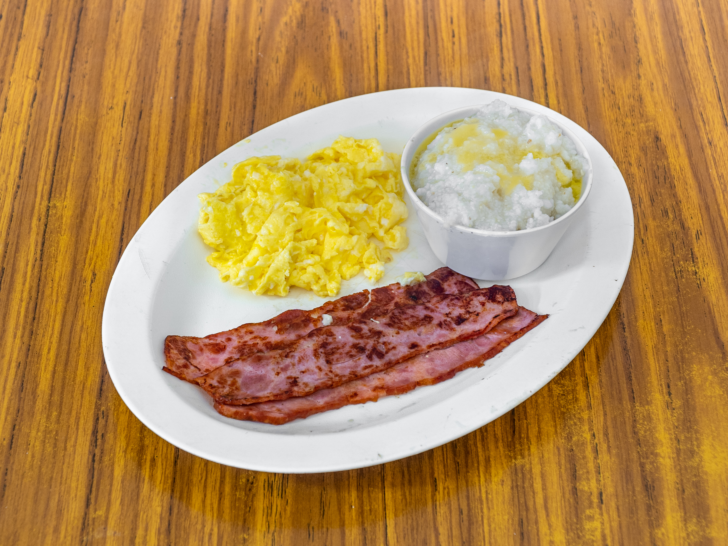 Order Kids Bacon, 1 Egg, Grits and Toast Plate food online from Lakewood Diner store, Atlanta on bringmethat.com