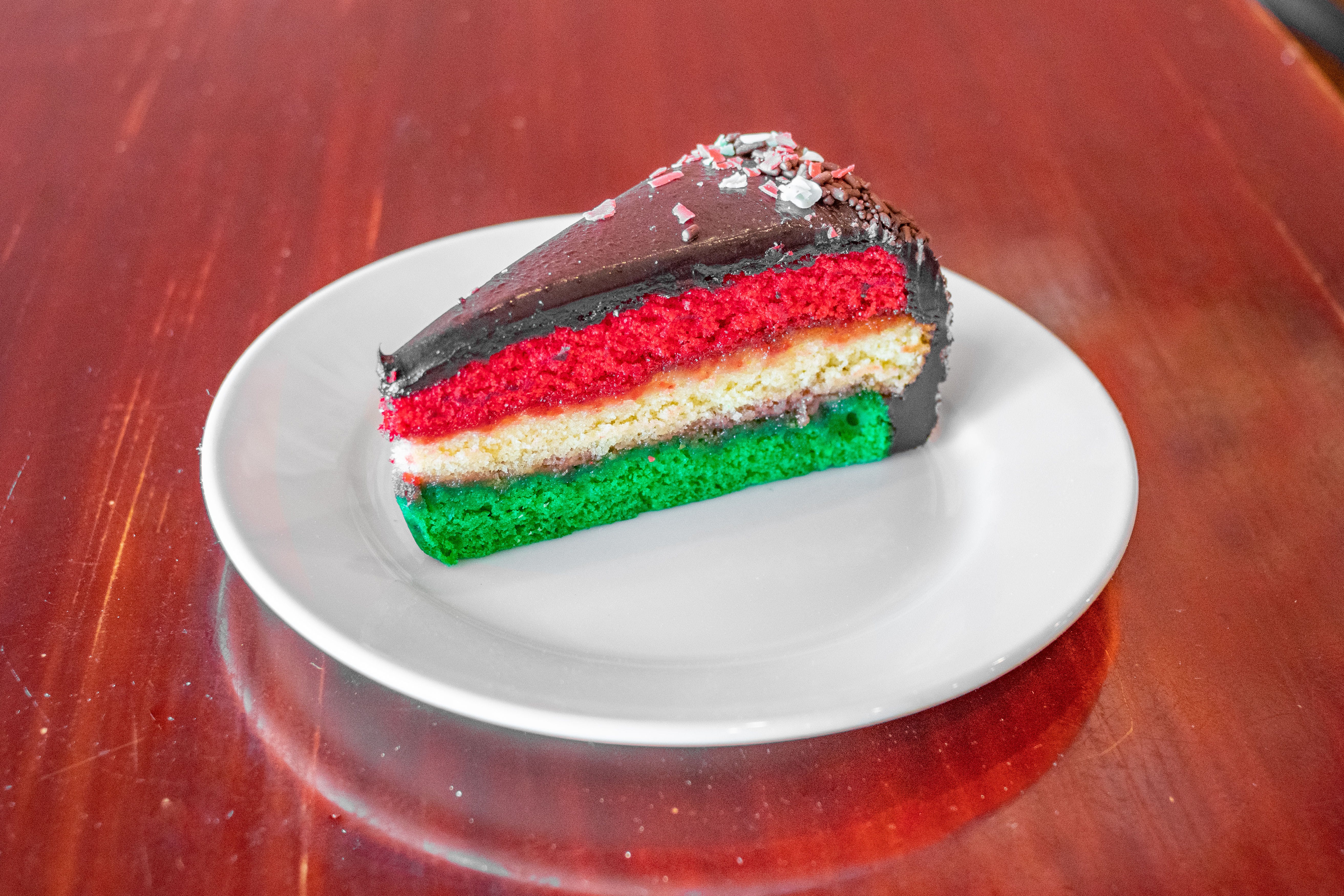 Order Rainbow Cake - Dessert food online from Julia's Pizza store, Orlando on bringmethat.com