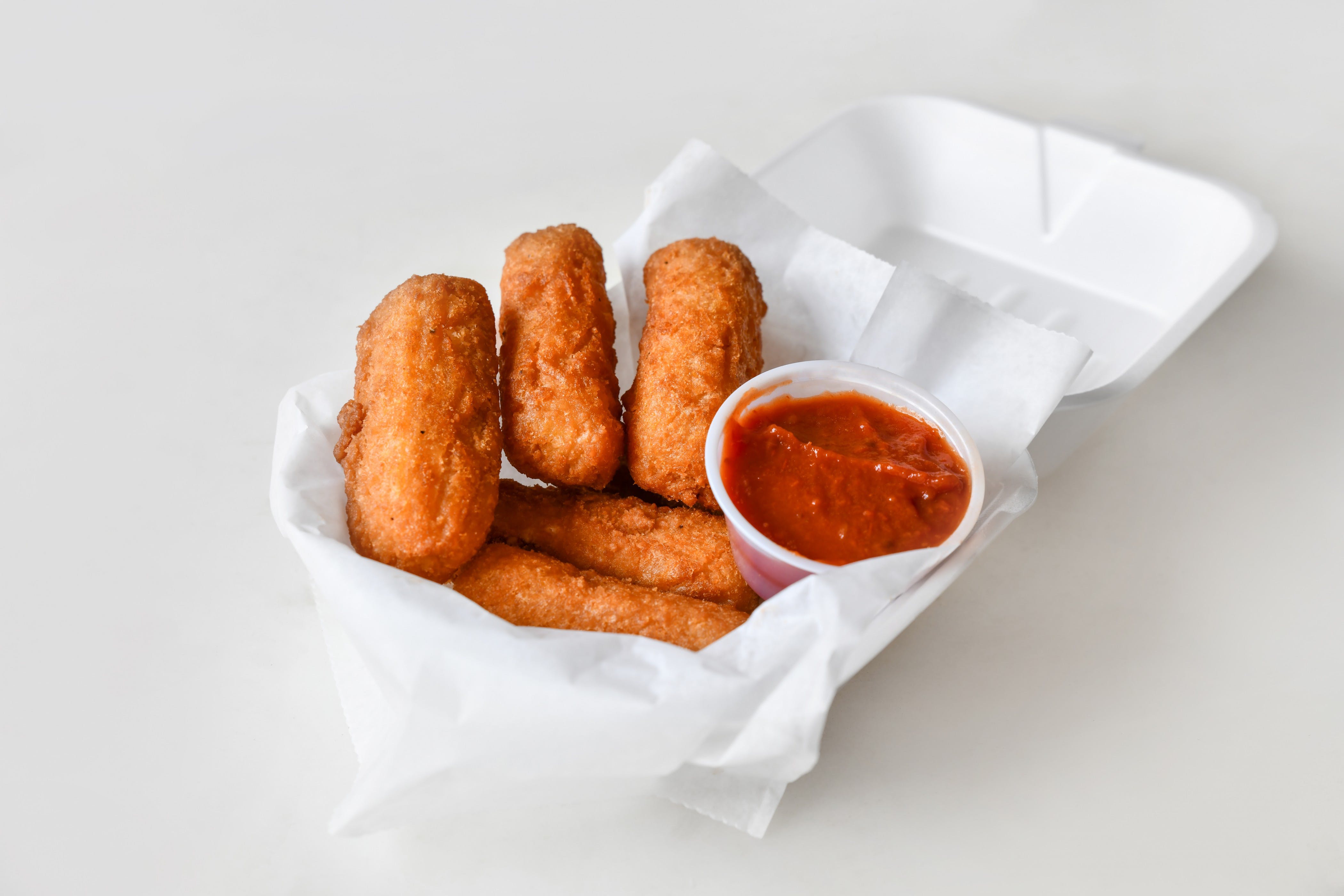 Order Mozzarella Sticks with Sauce - 5 Pieces food online from Nick Deli store, Rochester on bringmethat.com