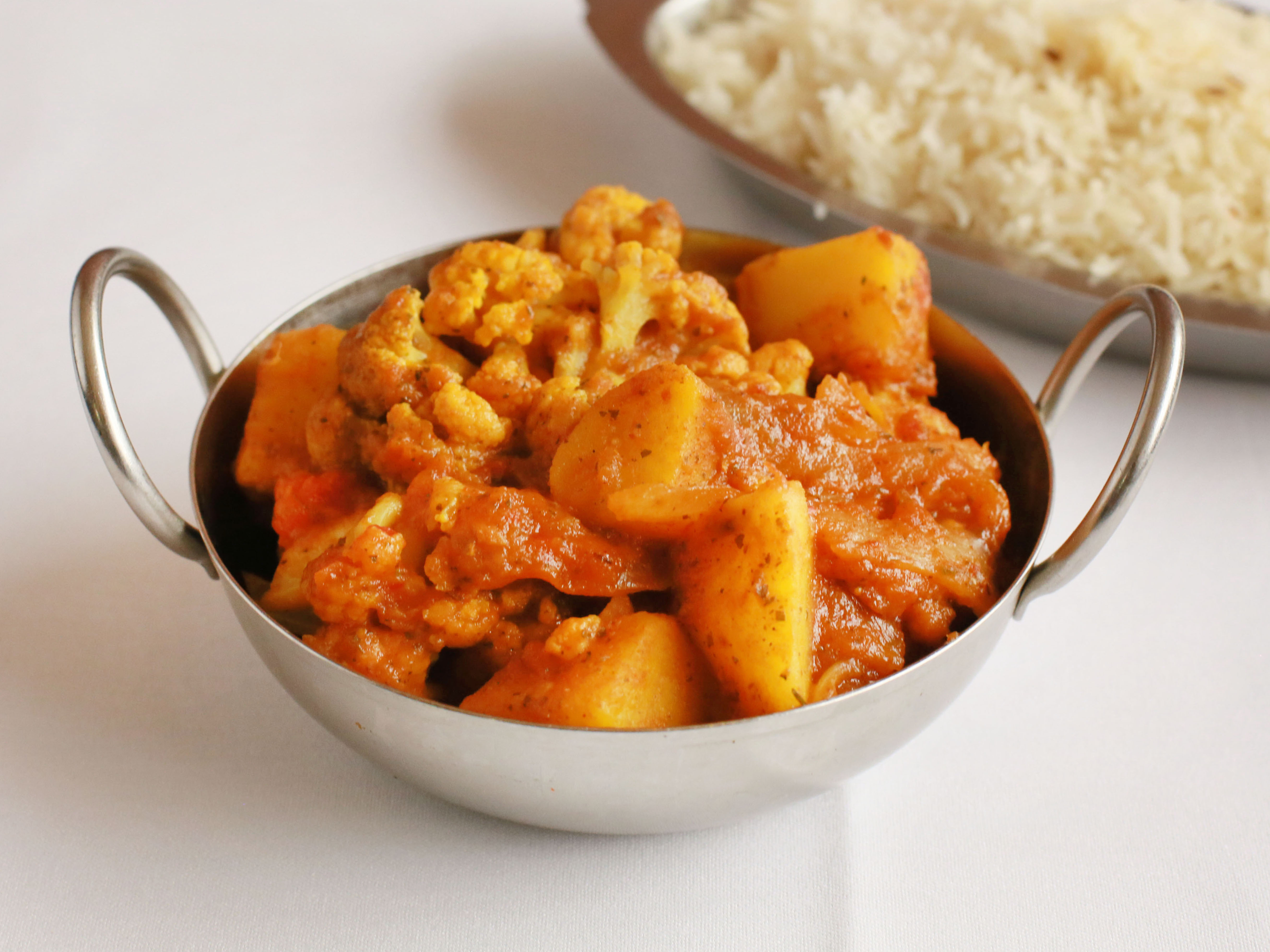 Order Aloo Gobhi Curry food online from Tandoor Restaurant store, Milwaukee on bringmethat.com