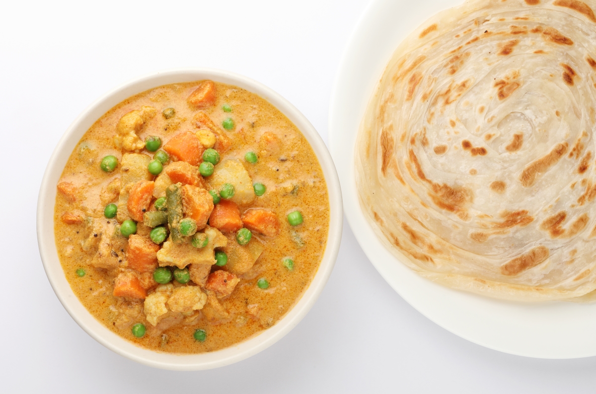 Order Parotta With Veg Kurma food online from Tropical Curry And Grill store, Pflugerville on bringmethat.com