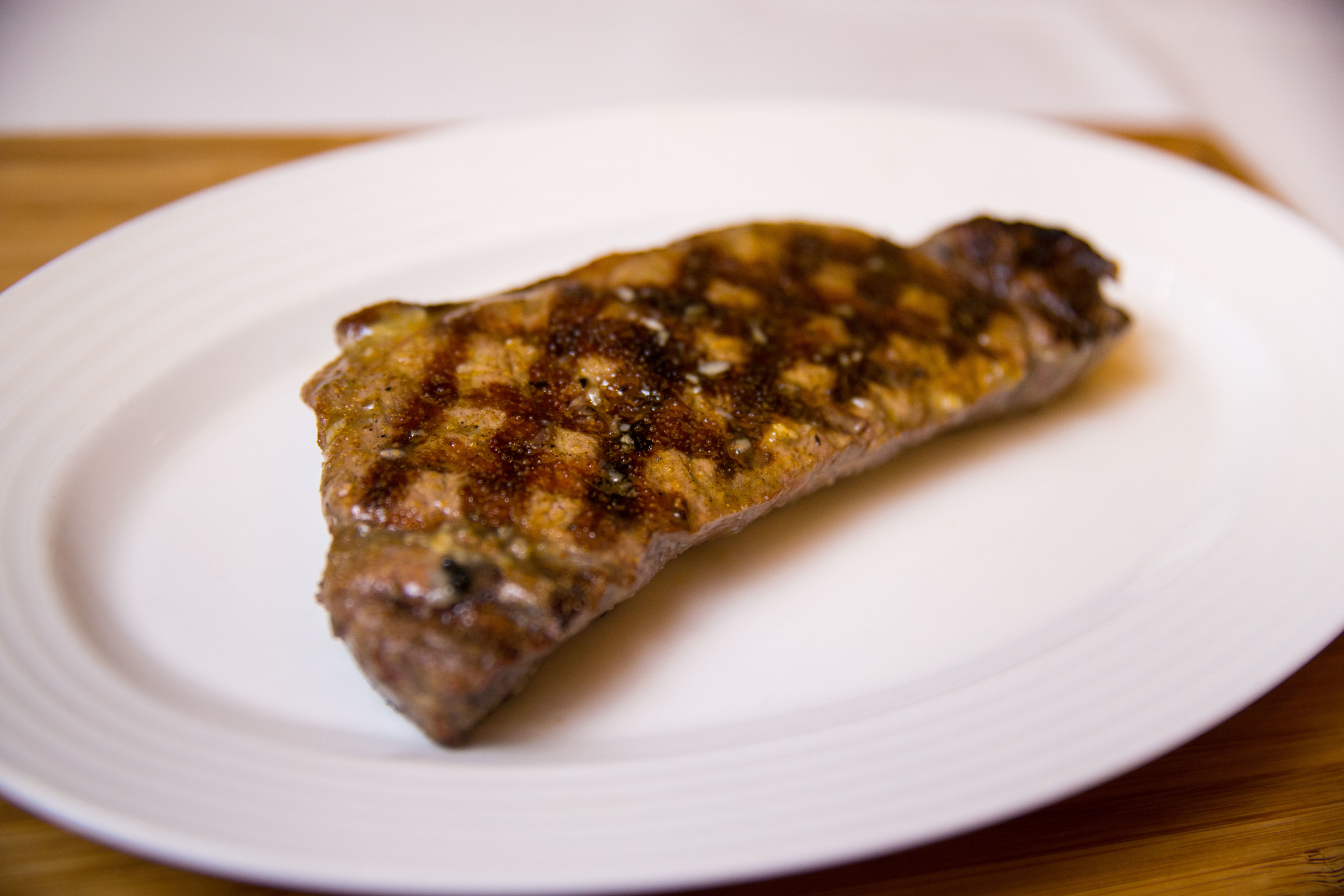 Order 16 oz. Prime New York Strip food online from Kirby Prime Steakhouse store, The Woodlands on bringmethat.com