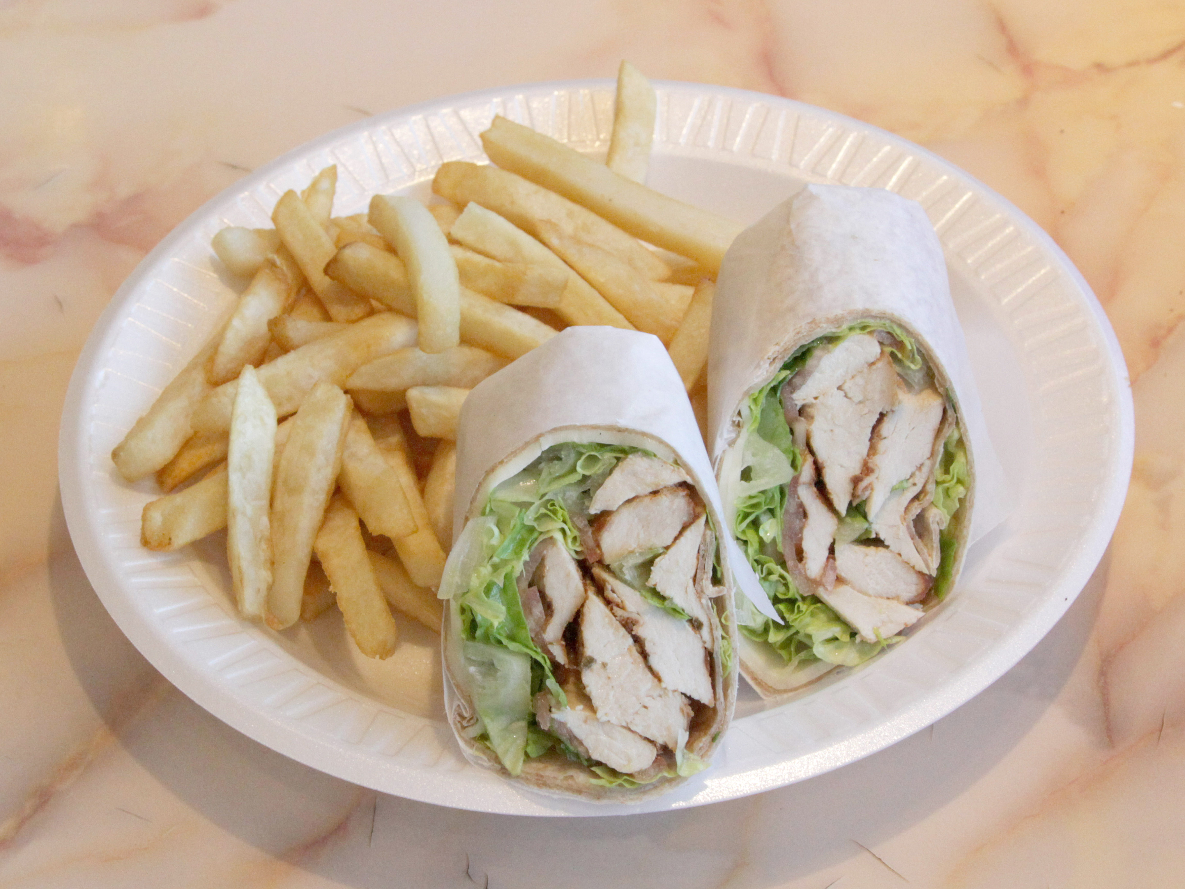 Order Grilled Chicken Mozzarella Wrap food online from Blinks Deli store, Long Island City on bringmethat.com