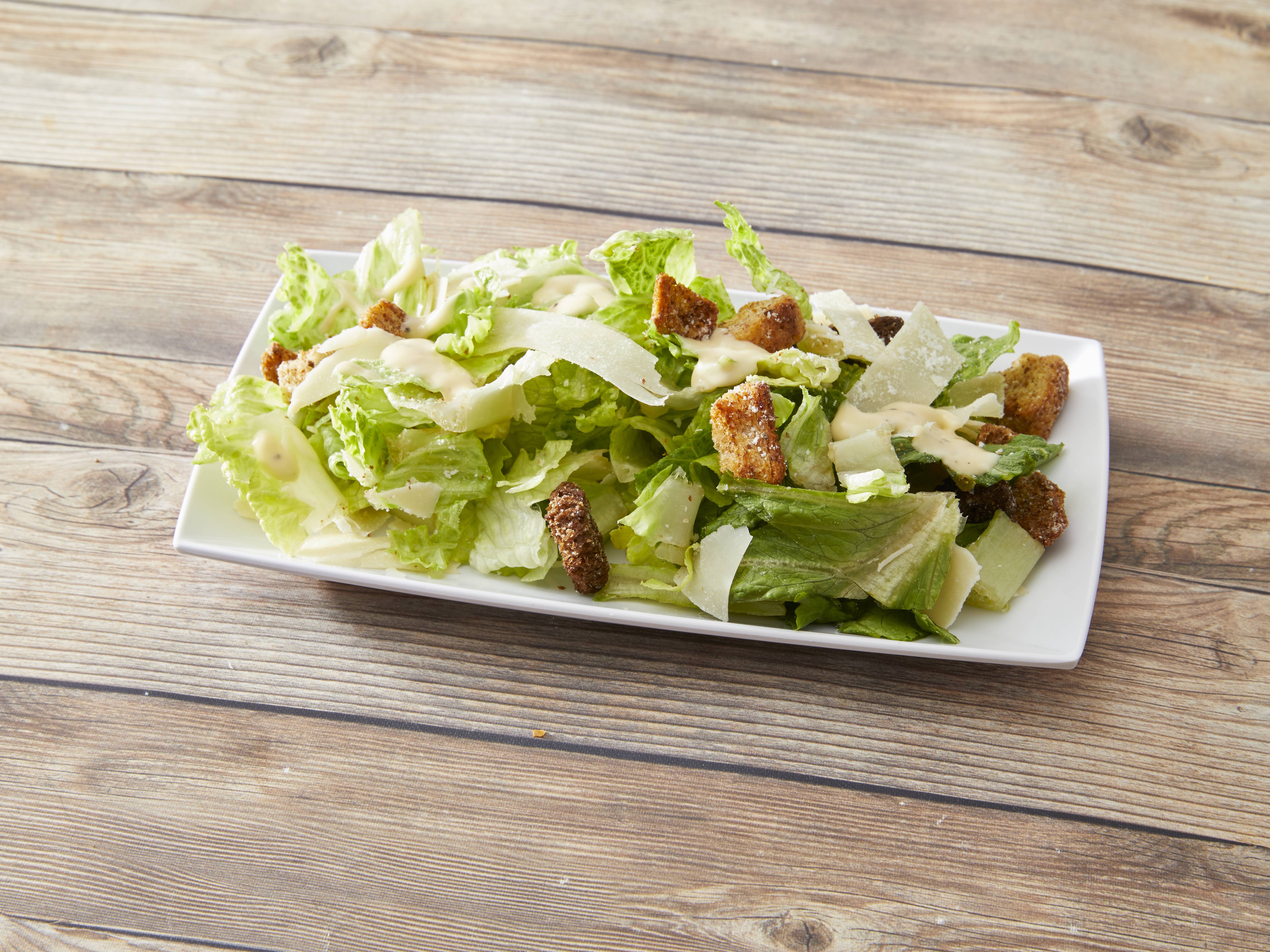 Order Caesar Salad food online from The Art Of Pizza store, Chicago on bringmethat.com