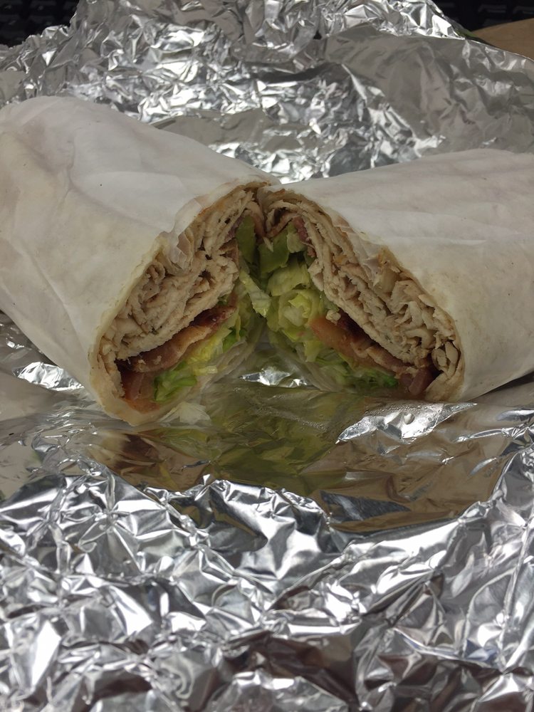 Order R1. Grilled Chicken Caesar Wrap food online from Pronto Cafe & Catering store, Newark on bringmethat.com