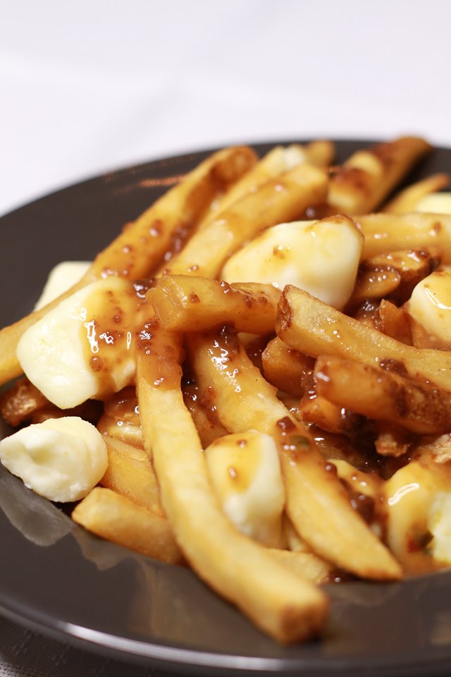 Order The Basic B**** - Poutine food online from Liberty Bar & Poutinerie store, Pontiac, MI on bringmethat.com