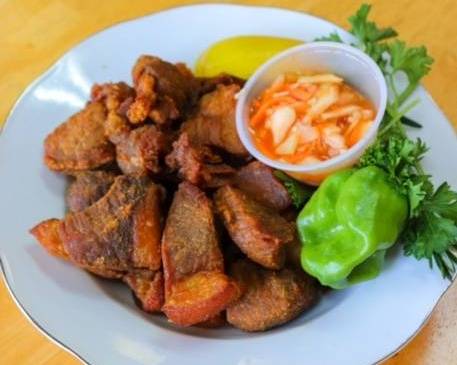 Order Griot / Fried Pork food online from Neguess Creole store, Union on bringmethat.com