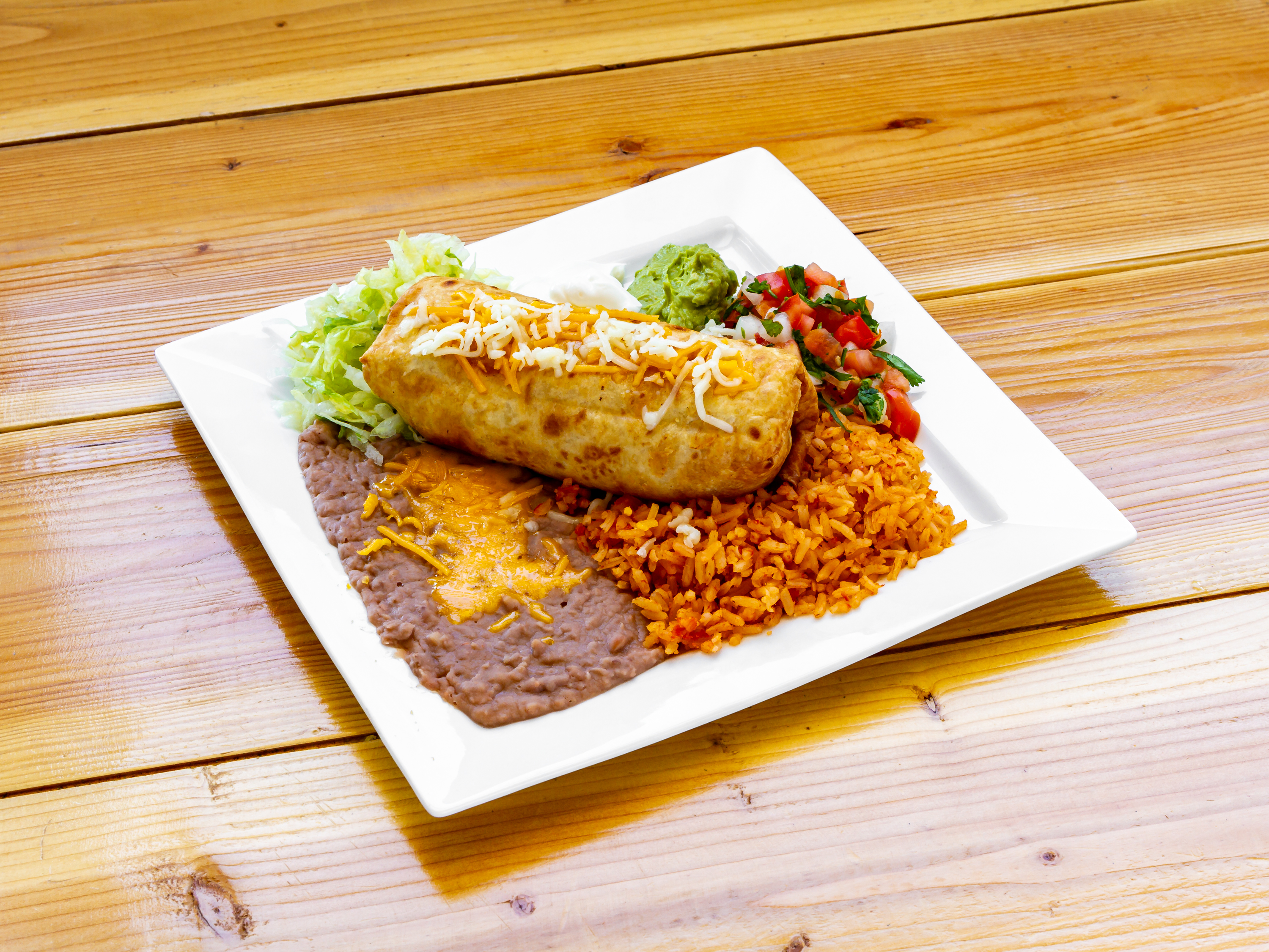 Order 7. Chimichanga Plate food online from Viva Burrito store, Tucson on bringmethat.com