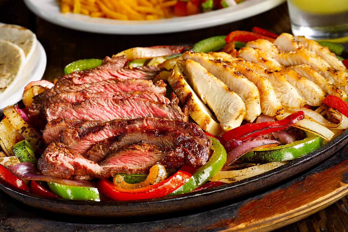 Order STEAK* & CHICKEN COMBO FAJITA food online from Miller Ale House store, Orland Park on bringmethat.com