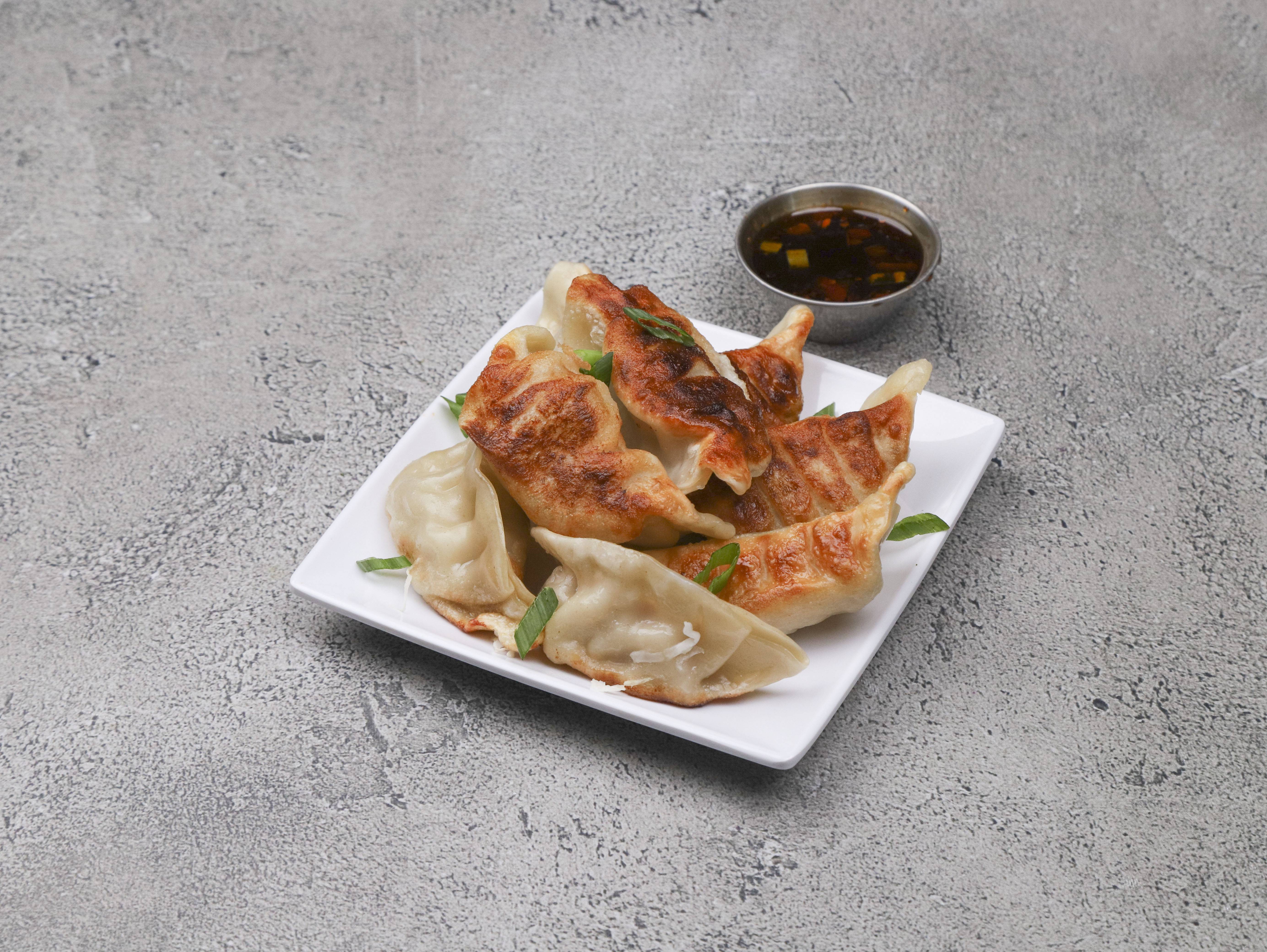 Order Fred Pork Dumplings food online from China Palace store, Austin on bringmethat.com