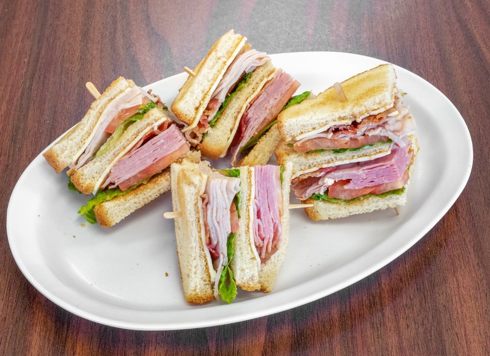 Order Lunch Club Sandwich with Chips food online from Famous George'S Cafe store, Fort Worth on bringmethat.com