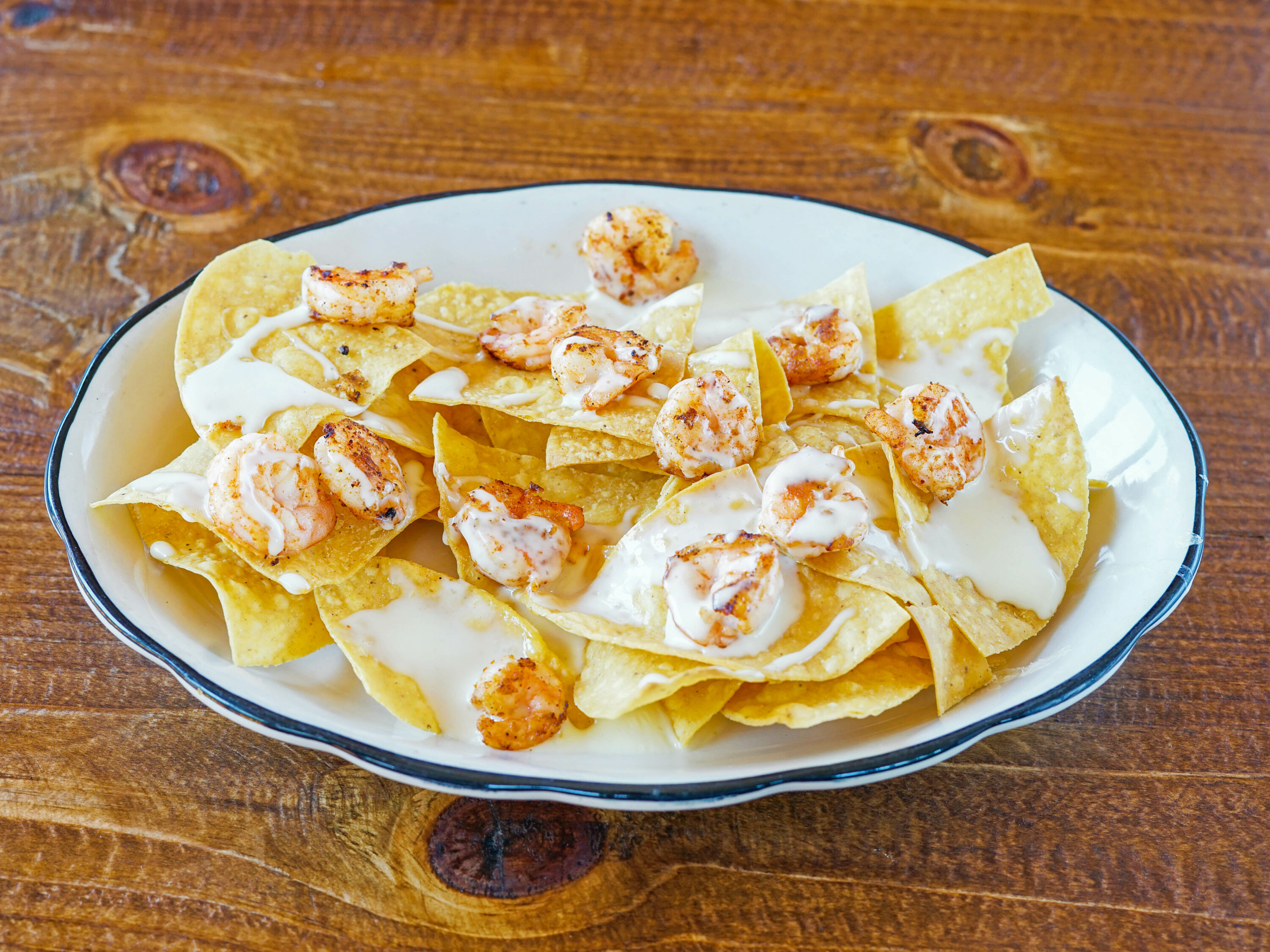 Order Nachos with Shrimp food online from Rey Azteca store, State College on bringmethat.com