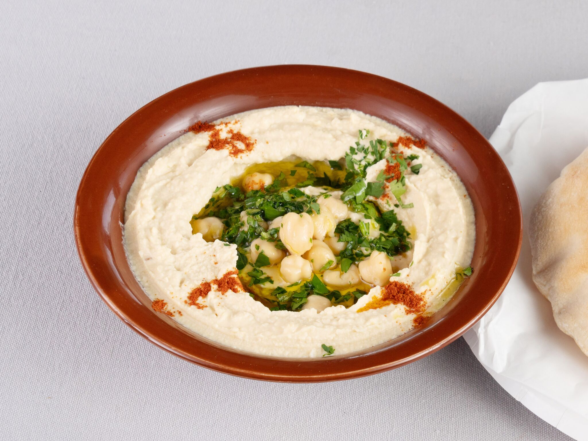 Order Hummus food online from Rest House Cafe store, Houston on bringmethat.com