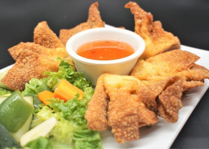 Order Crab Rangoons (5) food online from Kim Son Cafe  store, Houston on bringmethat.com
