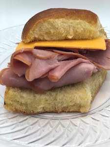 Order Hot Ham & Cheddar Box Lunch food online from Anitas Famous Rolls store, Kansas City on bringmethat.com