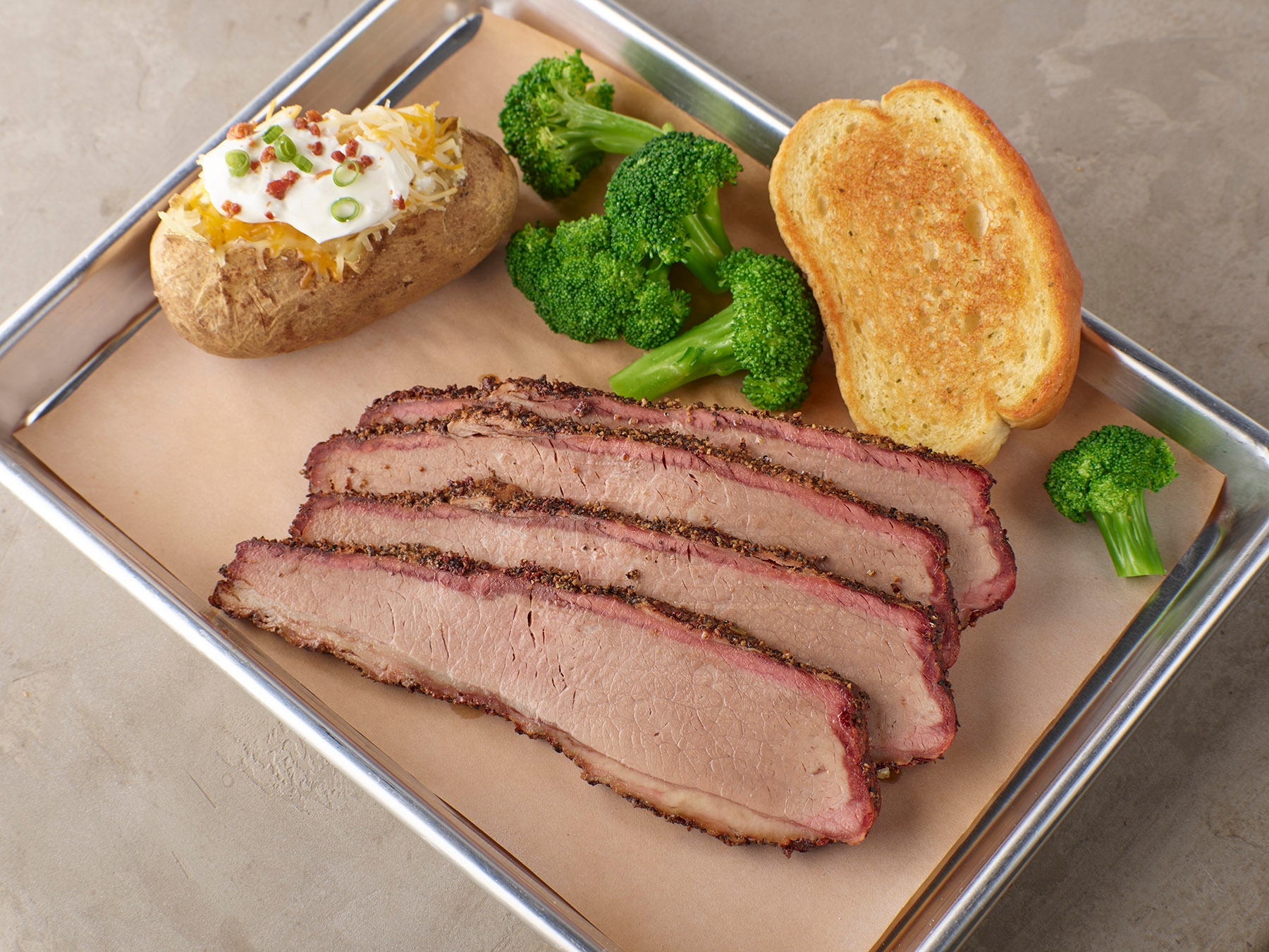 Order Texas Style Beef Brisket food online from Smokey Bones Barbeque & Grill store, Grove City on bringmethat.com