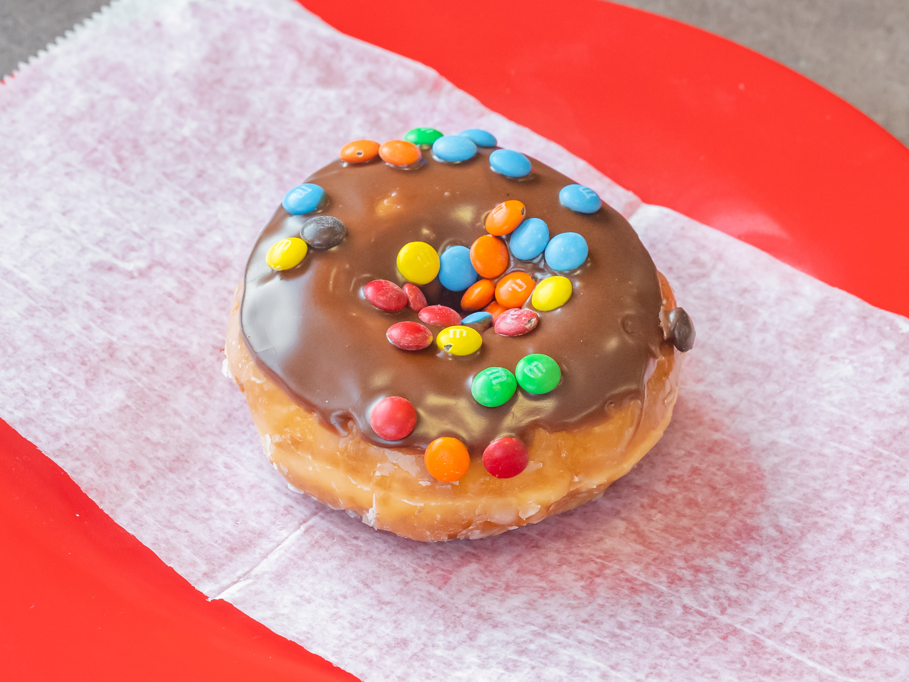 Order 8. M&Ms Donut food online from Donut Chef store, Roseville on bringmethat.com