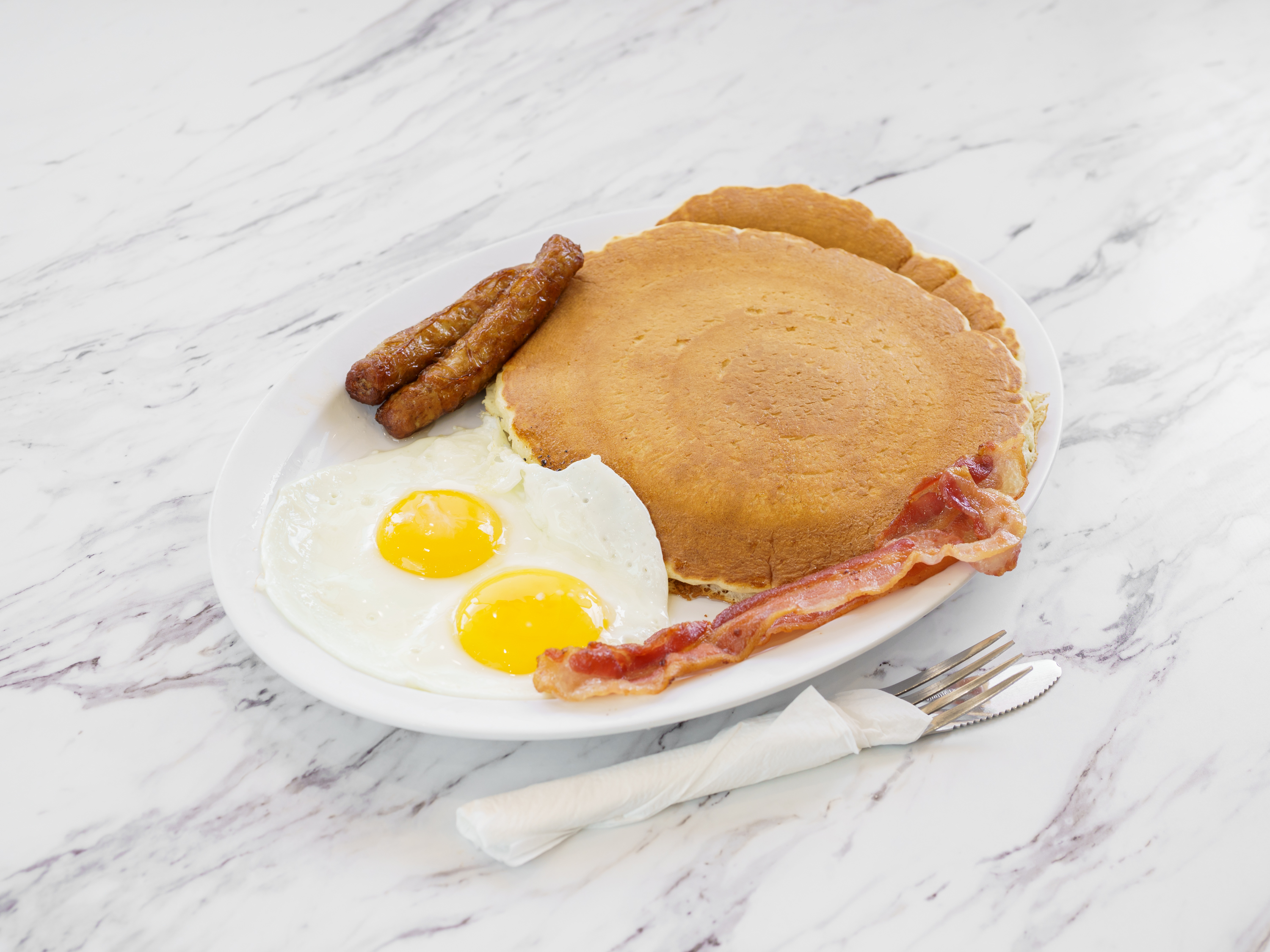 Order 2 Hot Cakes, 2 Eggs, 2 Bacon and 2 Sausage food online from Yellow Basket store, Carson on bringmethat.com