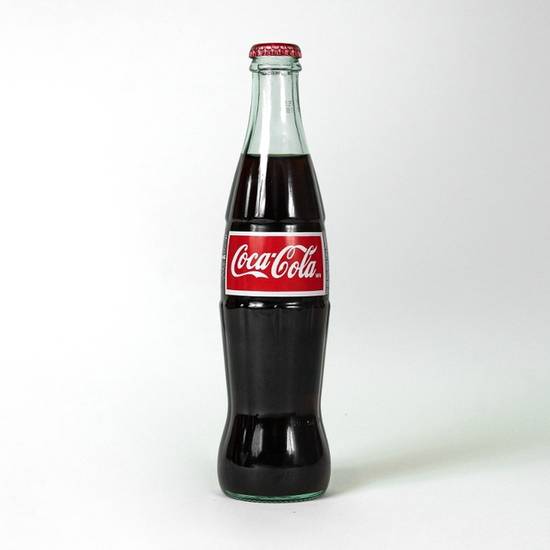 Order Mexican Coke (bottle) food online from Lily Mae Hot Chicken store, Los Angeles on bringmethat.com