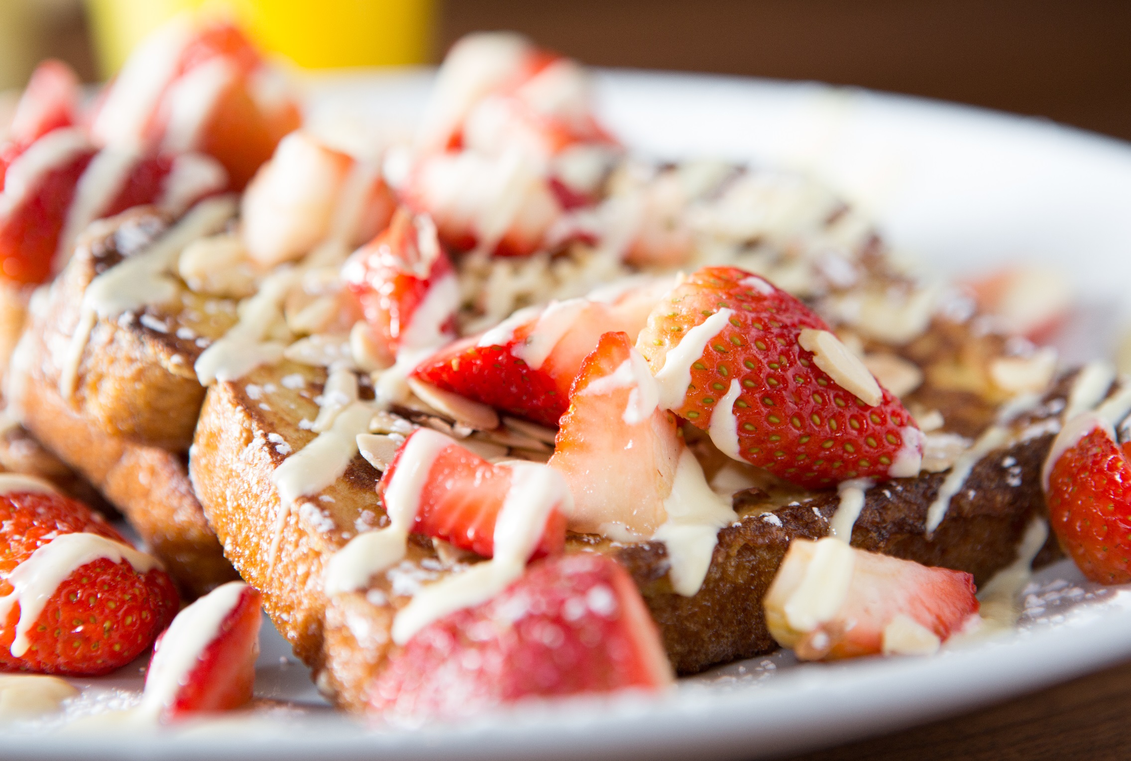 Order Strawberry Almond French Toast food online from Wildberry Pancakes & Cafe store, Chicago on bringmethat.com