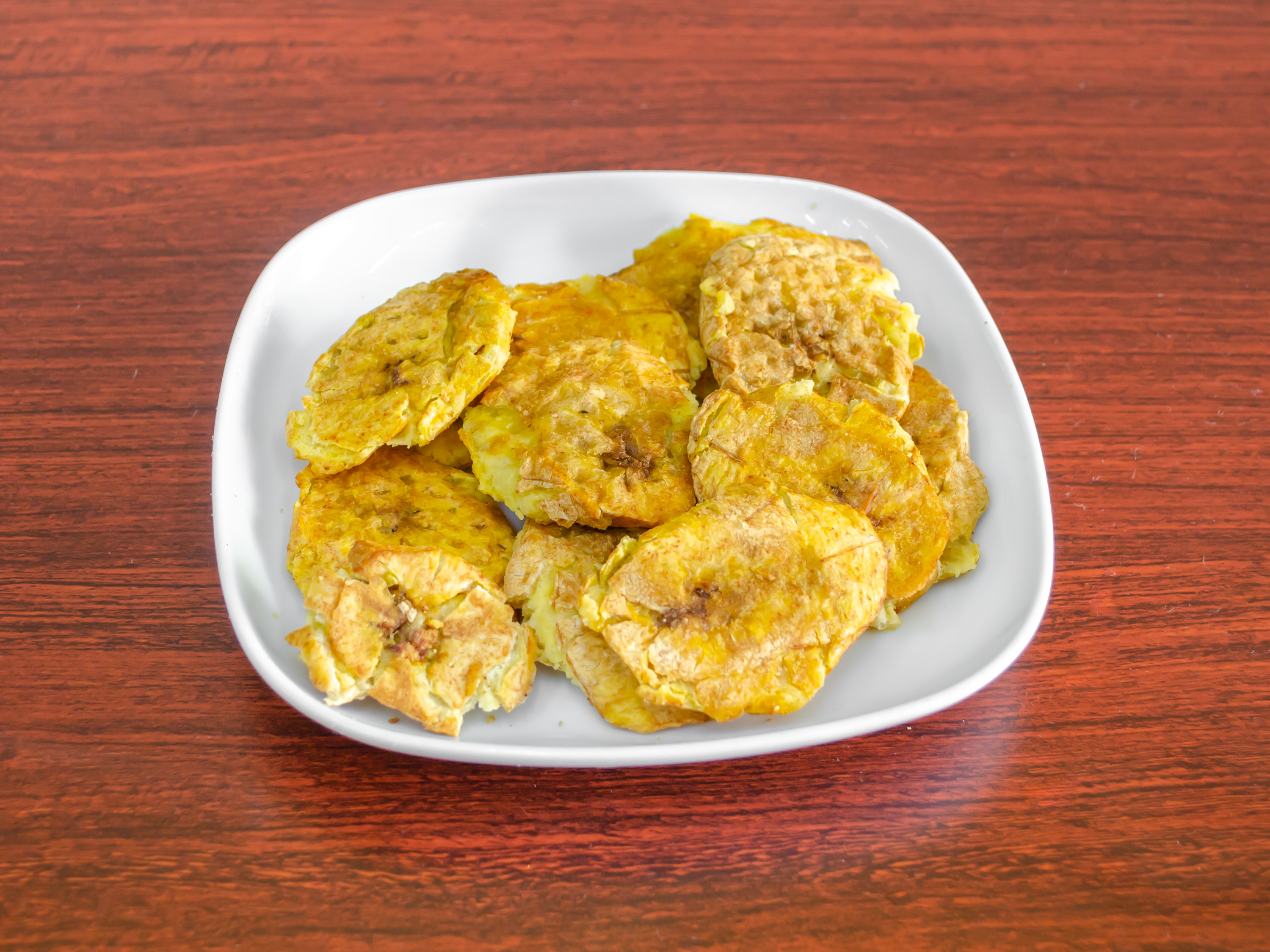 Order Tostones food online from Pica Pollo Real store, Newark on bringmethat.com