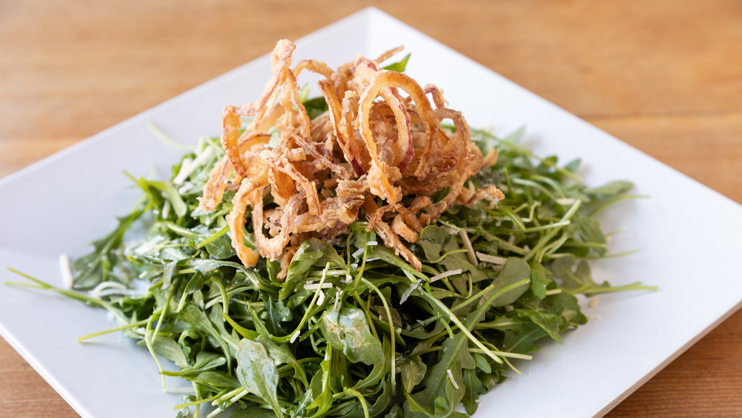 Order Arugula Salad food online from Stout Burger store, Palm Springs on bringmethat.com