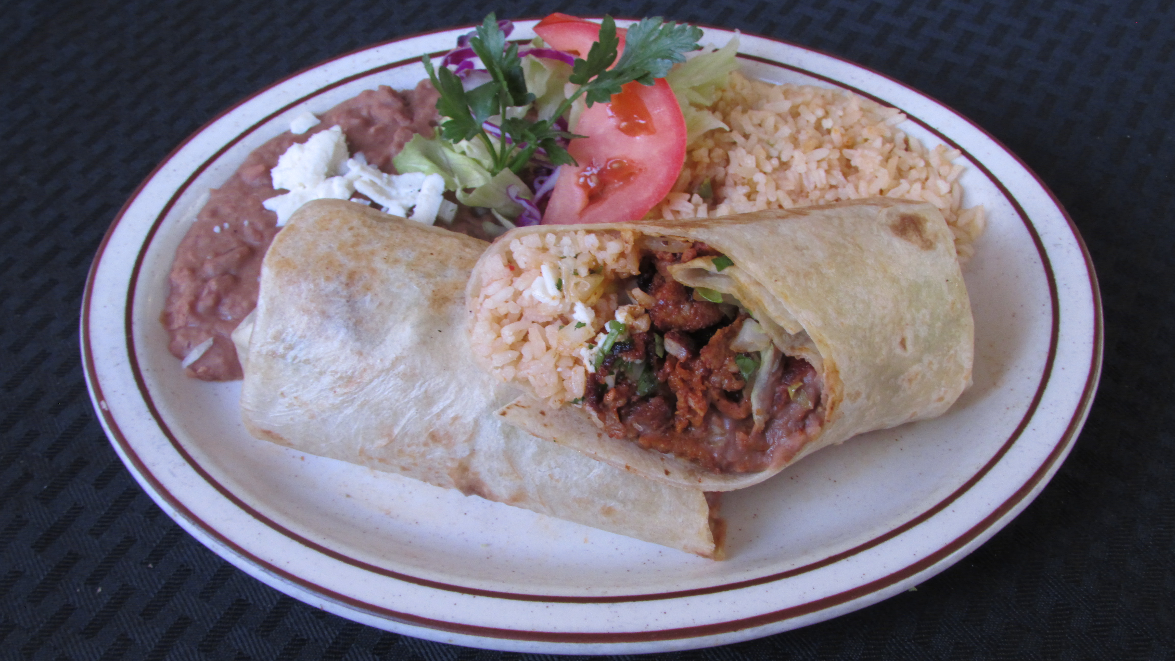 Order Al Pastor Burrito food online from Tortillas Restaurant store, Cathedral City on bringmethat.com