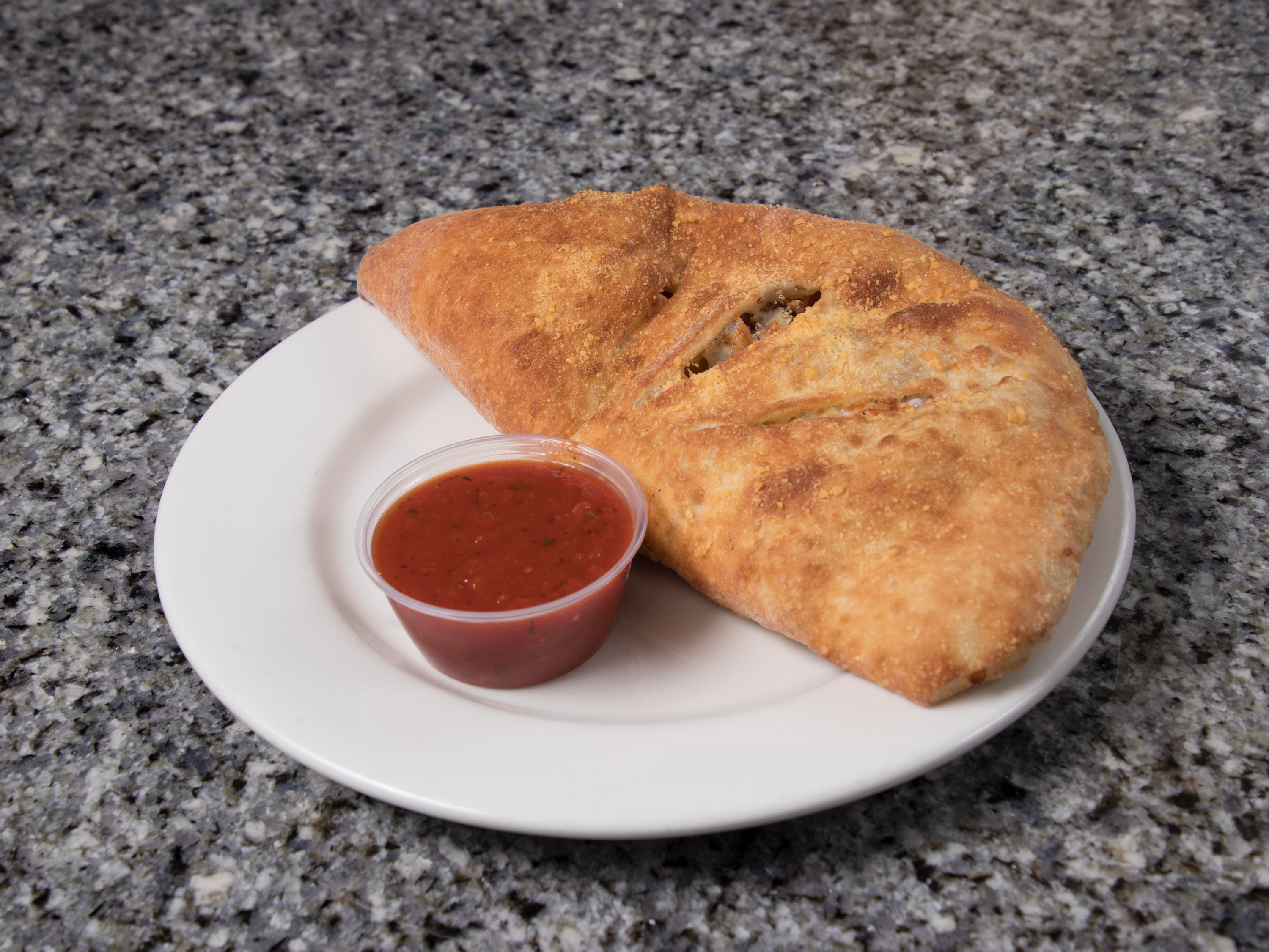 Order Italian Combo Calzone food online from Star Pizza & Pasta store, Canton on bringmethat.com