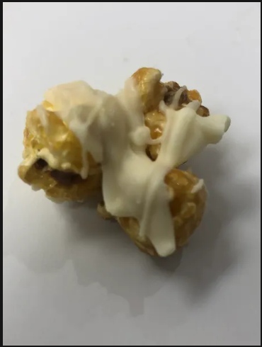 Order White Chocolate Drizzle food online from Avery's Savory Popcorn store, Dallas on bringmethat.com